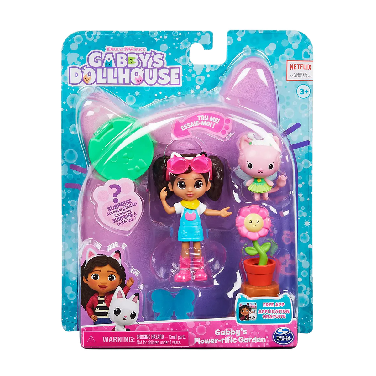 Zestaw zabawek z lalką, królikiem, kwiatami i opakowaniem z motywem kota.