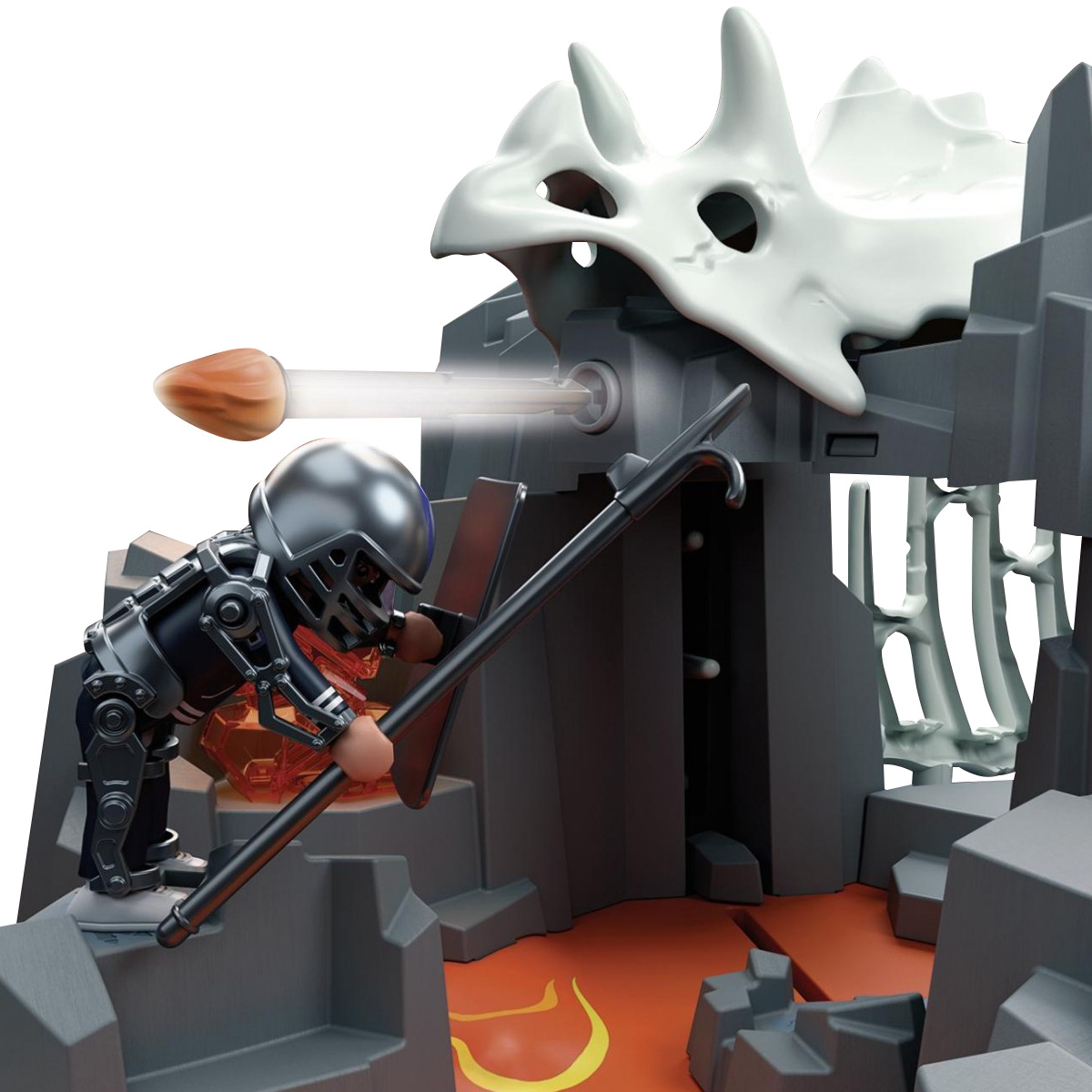 Spielfigur schießt Projektil auf einen Dinosaurierschädel.