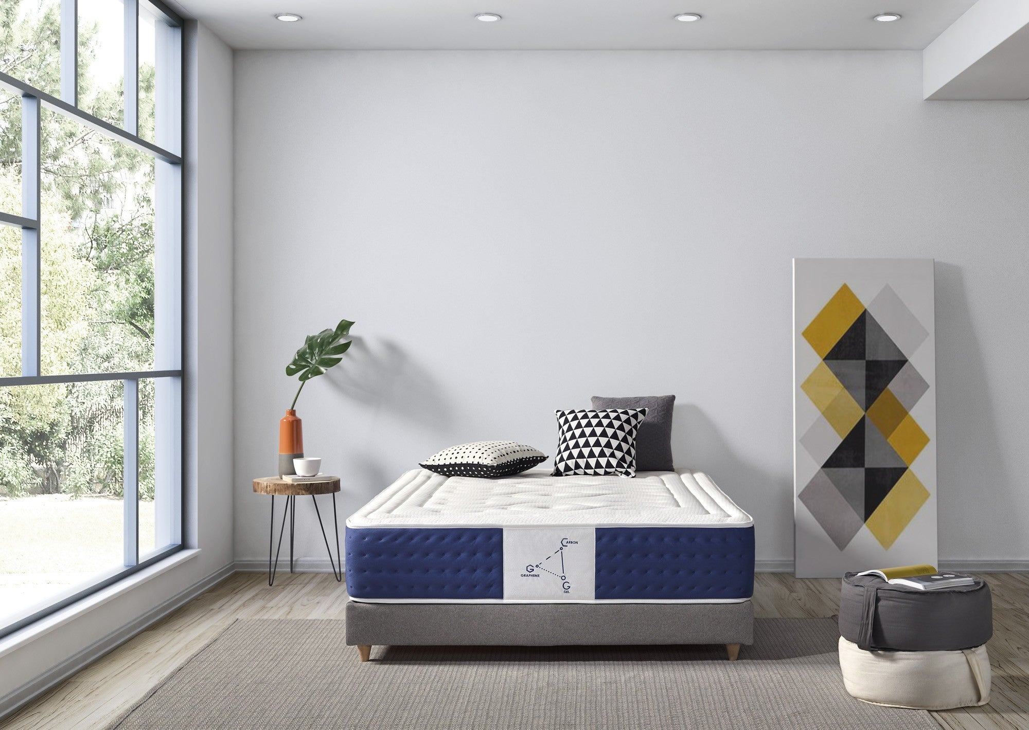 Escena de dormitorio con cama, mesa auxiliar y arte en la pared.