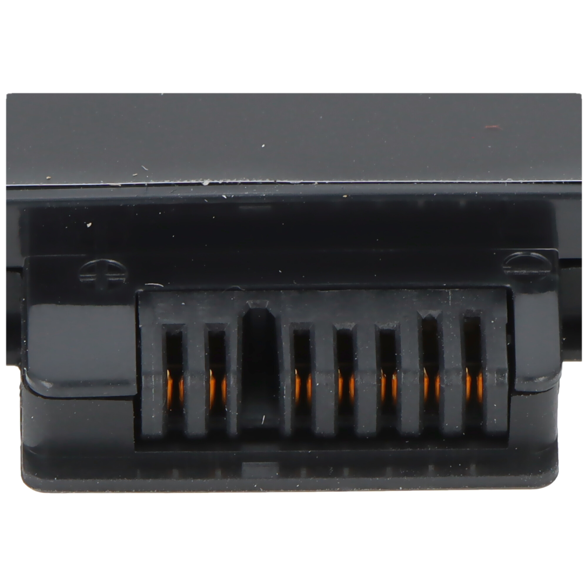 A close-up of a black battery connector with gold-colored contacts.