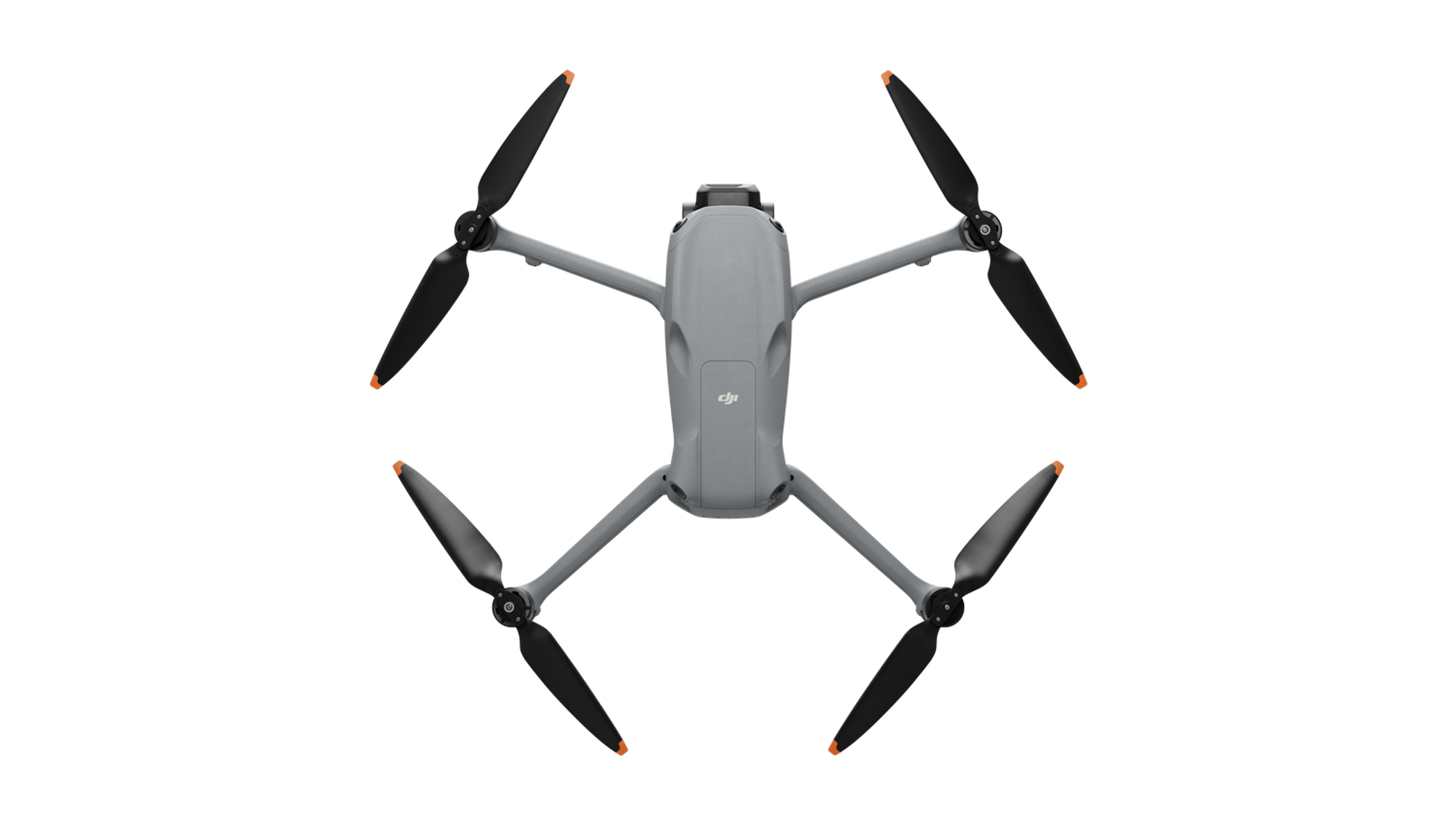 Dron widziany z góry, z czterema śmigłami i szarym korpusem.