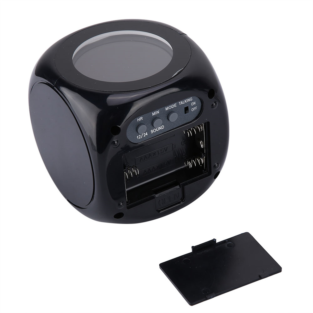 Schwarzer würfelförmiger Wecker. Zeigt die Zeit an. Hat HR, MIN, SOUND, 12/24 und Batteriefach offen.