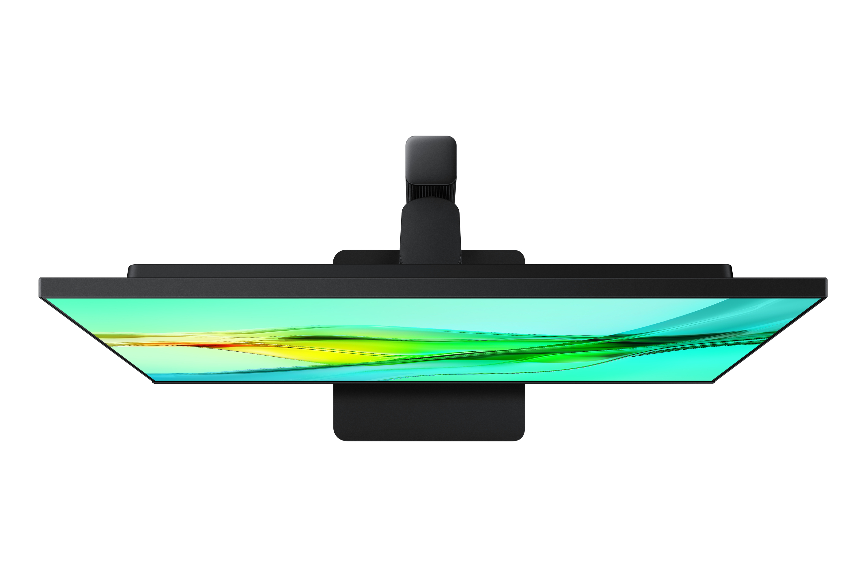 Widok z góry na czarny monitor komputera z zielono-żółtym gradientem na ekranie.