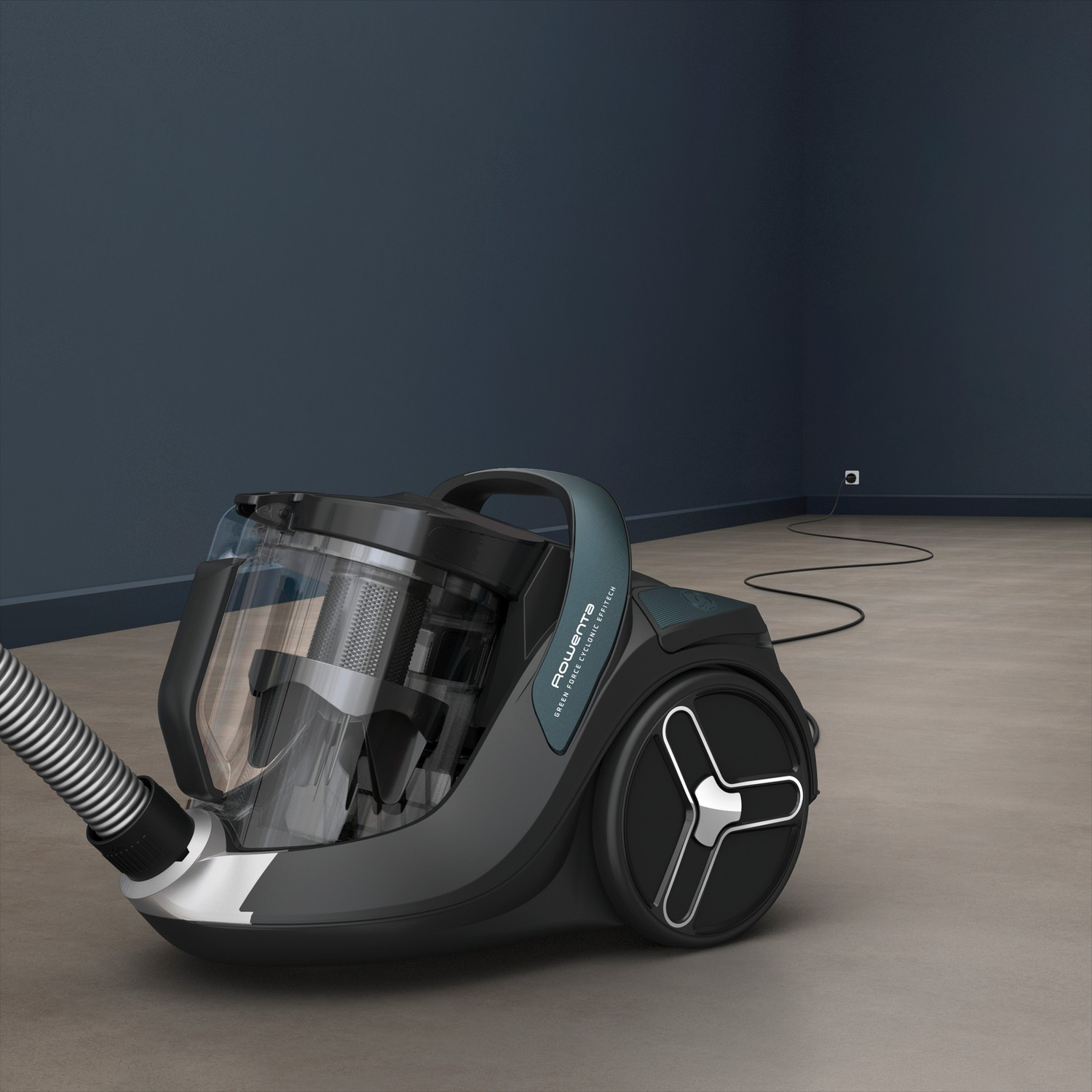 Odkurzacz w pokoju w szarej i niebieskiej tonacji, w pobliżu gniazdka i przewodu.