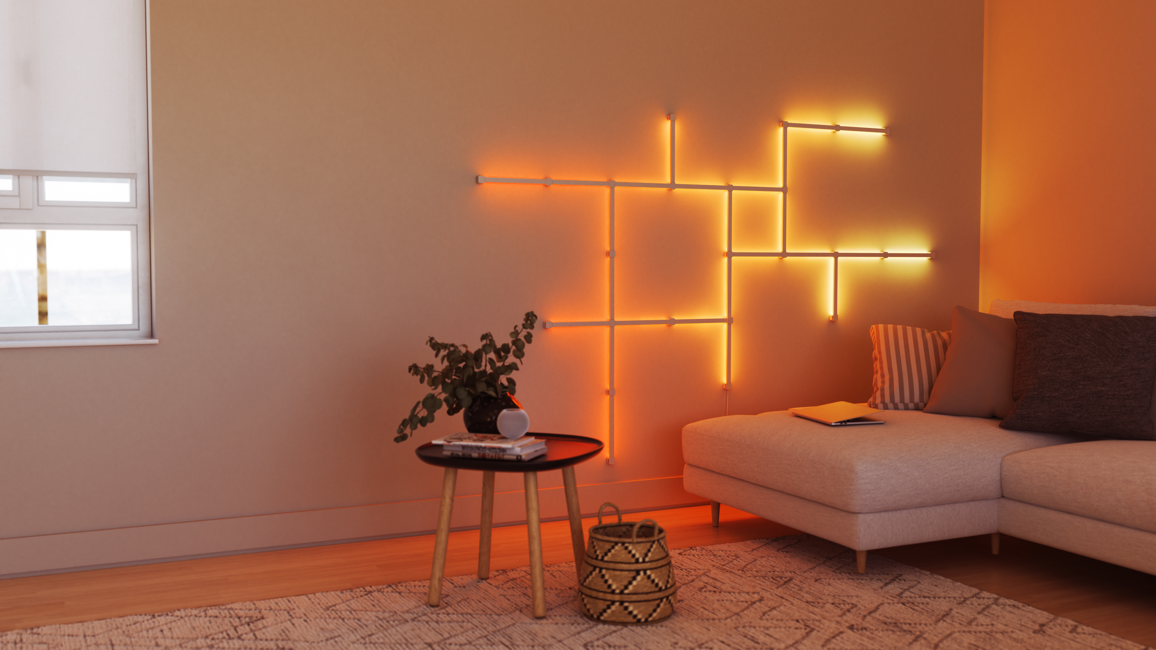 Stanza moderna con divano, tavolo e luci decorative a parete in tonalità arancione.