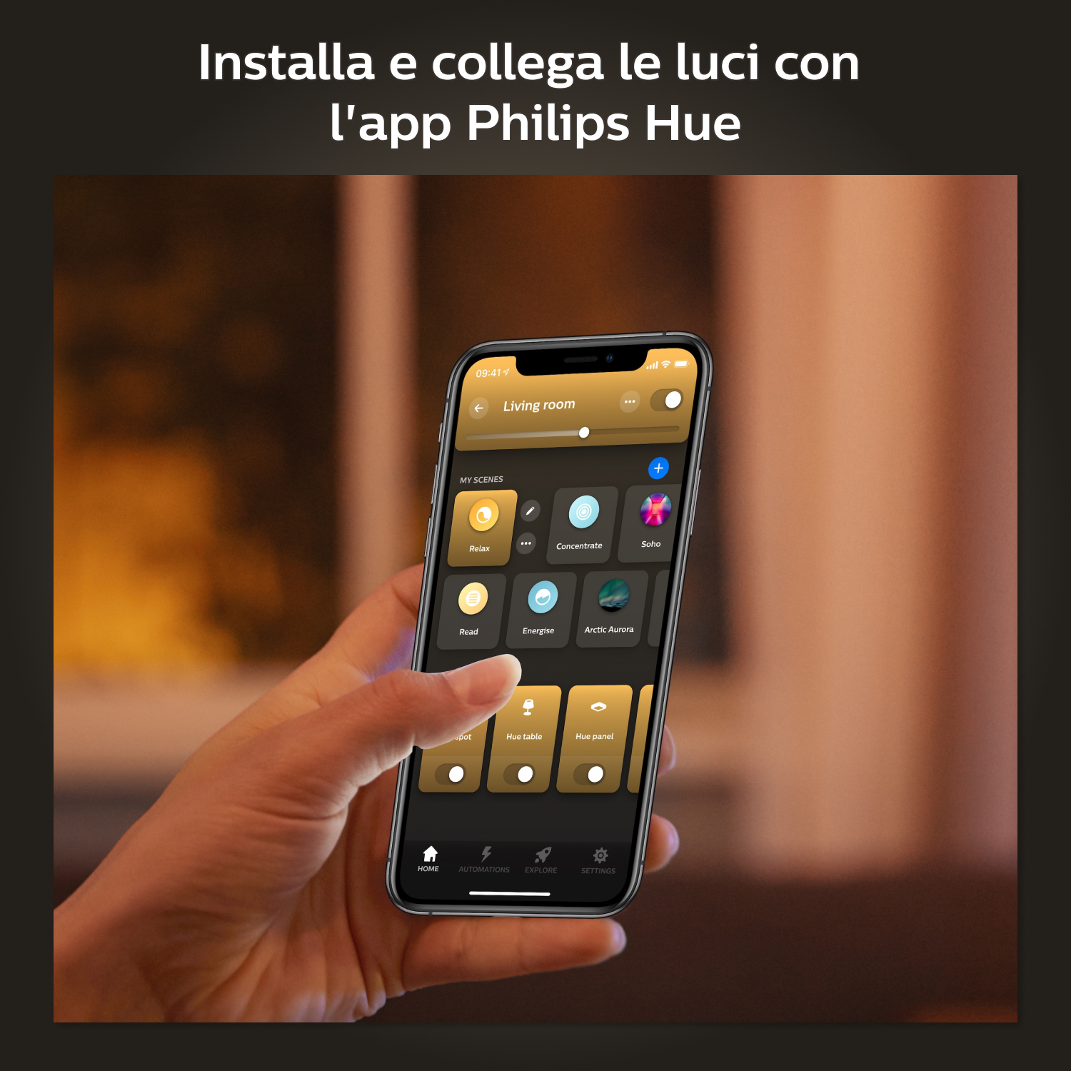 Osoba trzymająca telefon z aplikacją Philips Hue, z włączonymi światłami.