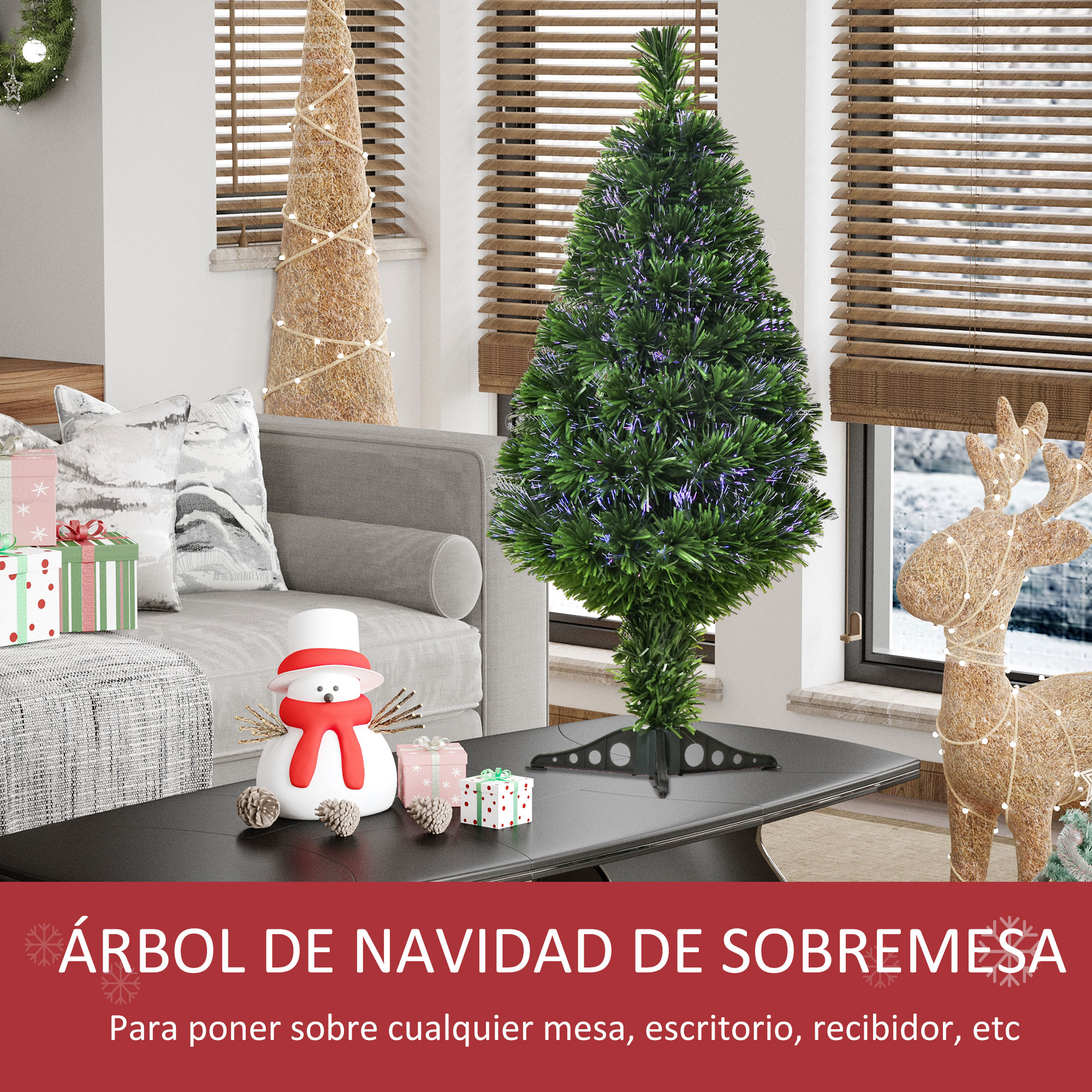 Pequeño árbol de Navidad de sobremesa con adornos sobre una mesa.