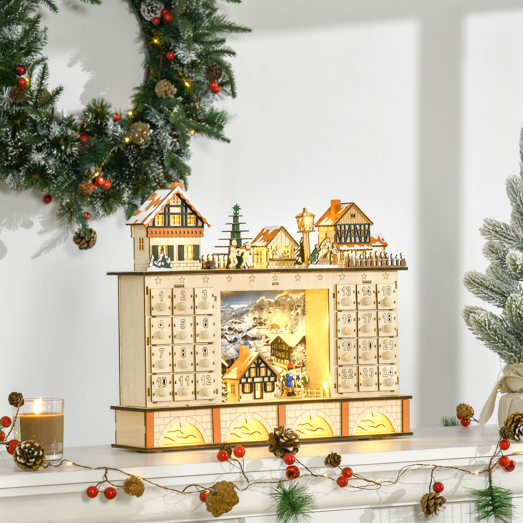 Un calendario de adviento de madera en forma de pueblo, con cajones numerados y una escena invernal.