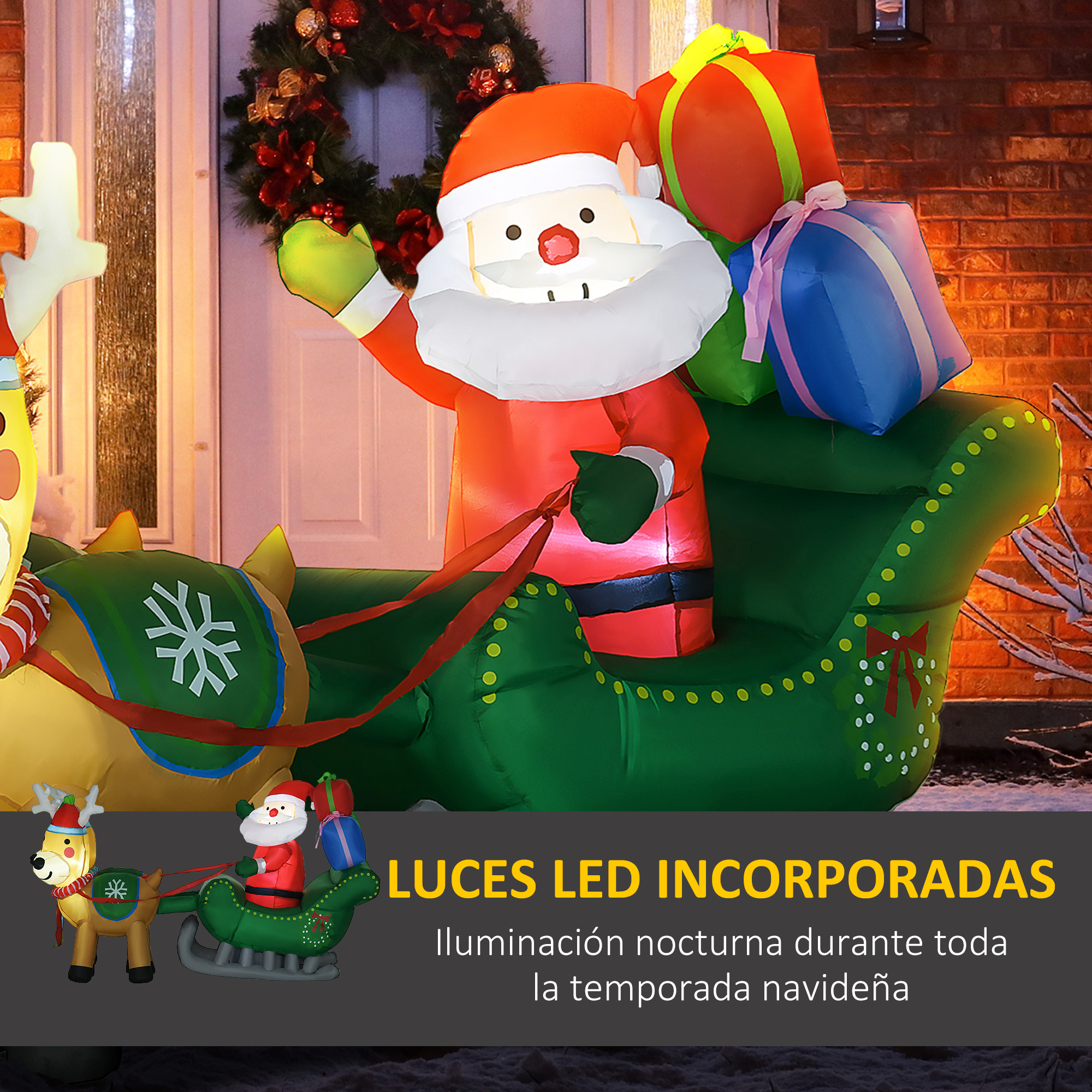 Un Papá Noel inflable en un trineo verde con regalos. Un reno tira de un trineo más pequeño.