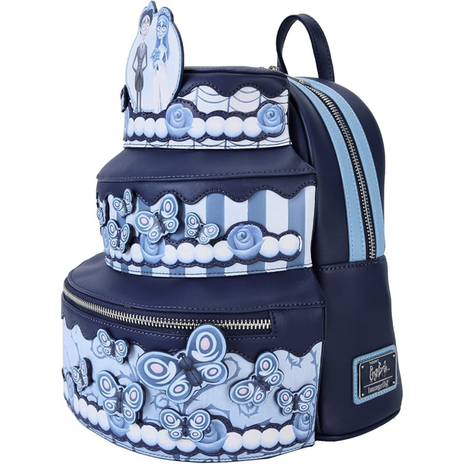 Una mochila con forma de pastel con un diseño de Tim Burton. Es azul oscuro con detalles y mariposas azules claras.