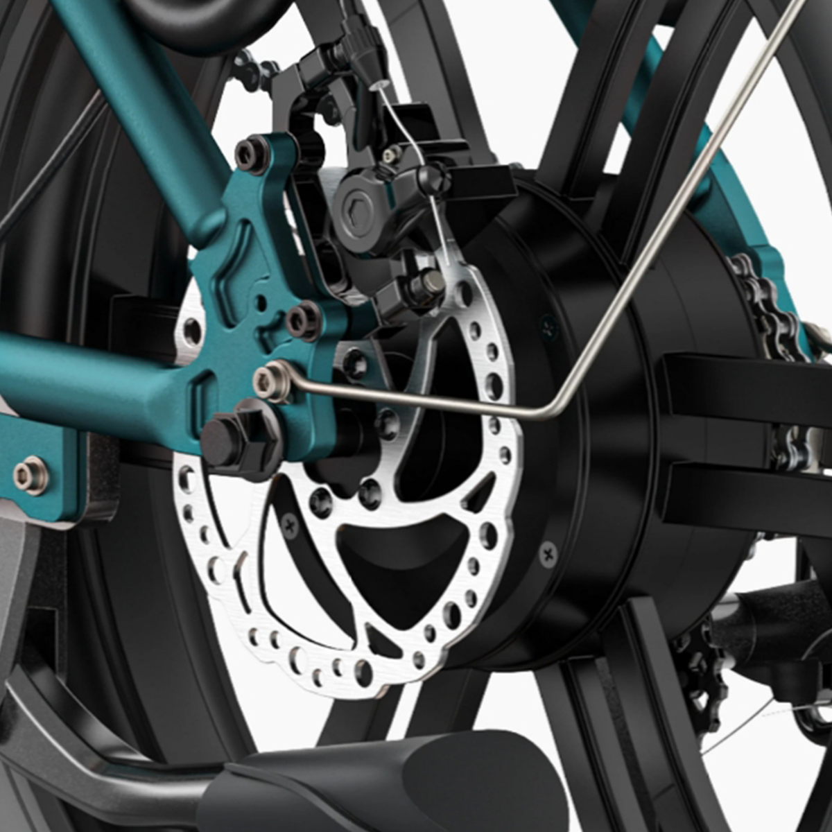 Zbliżenie tylnego koła roweru z hamulcem tarczowym. Rama jest turkusowa, koło czarne.