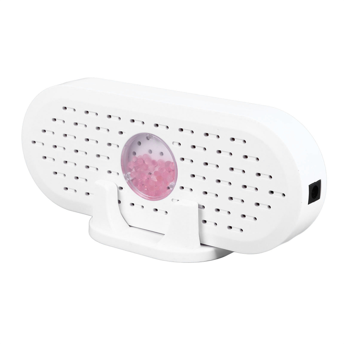 Weißer Luftentfeuchter mit sichtbaren rosa Perlen, auf einem weißen Ständer. Hat Perforationen und einen schwarzen Stromanschluss.