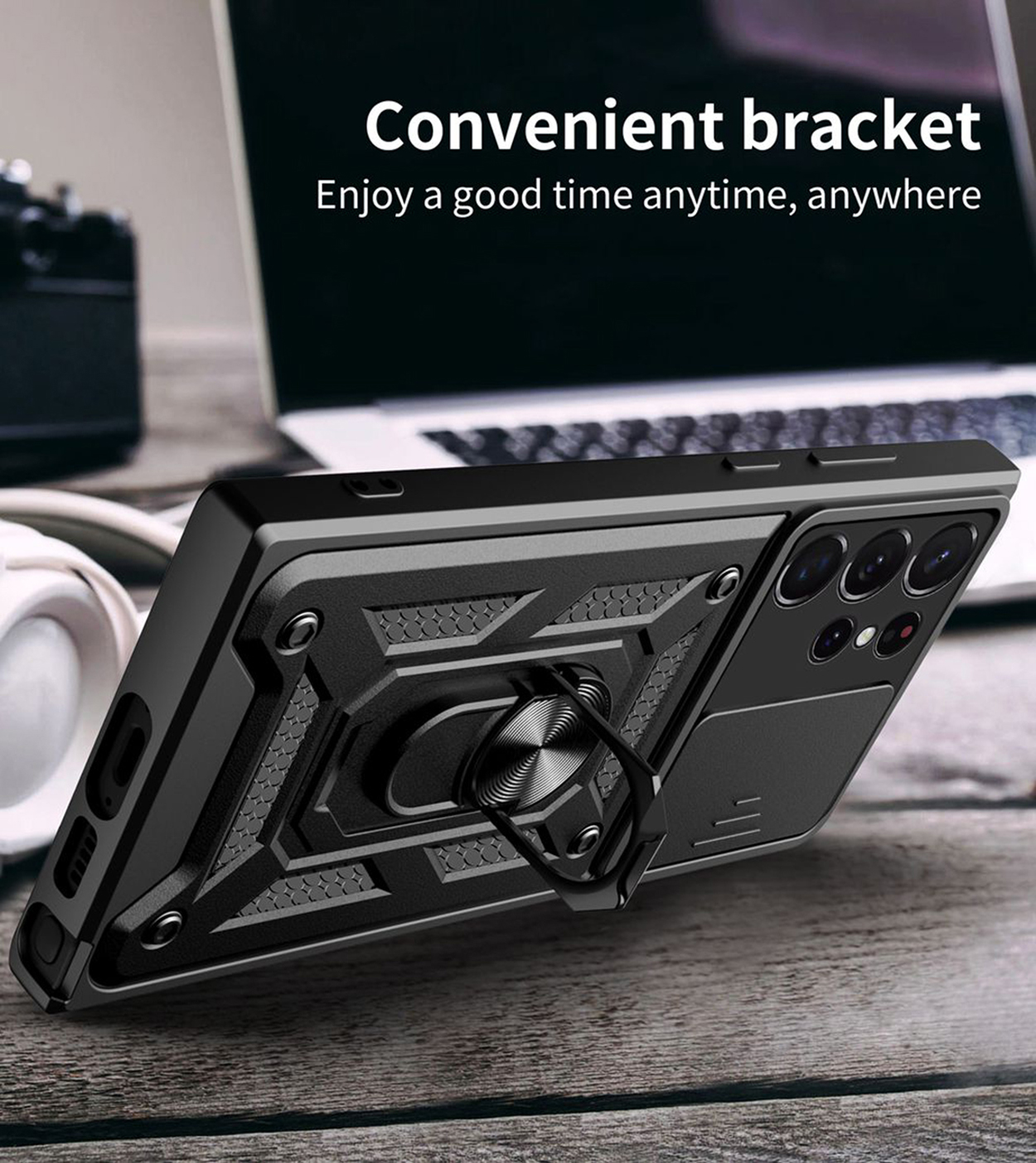 Coque de téléphone noire avec un support d'anneau, sur un bureau en bois avec un ordinateur portable.
