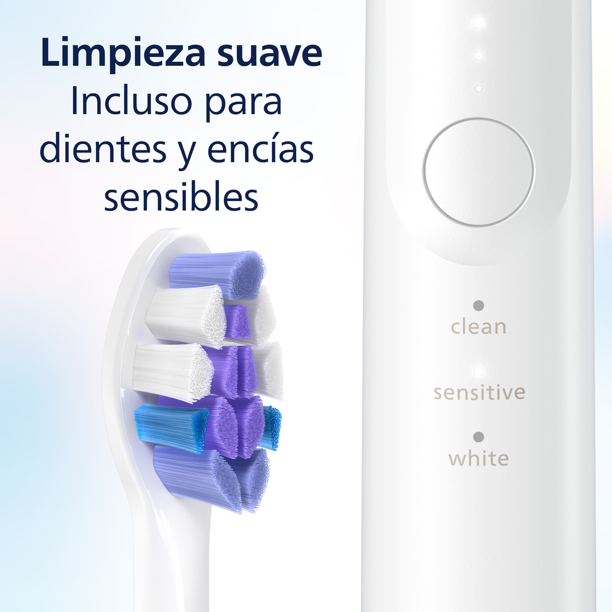 Zbliżenie na główkę szczoteczki do zębów z kolorowym włosiem i przyciskiem na uchwycie.