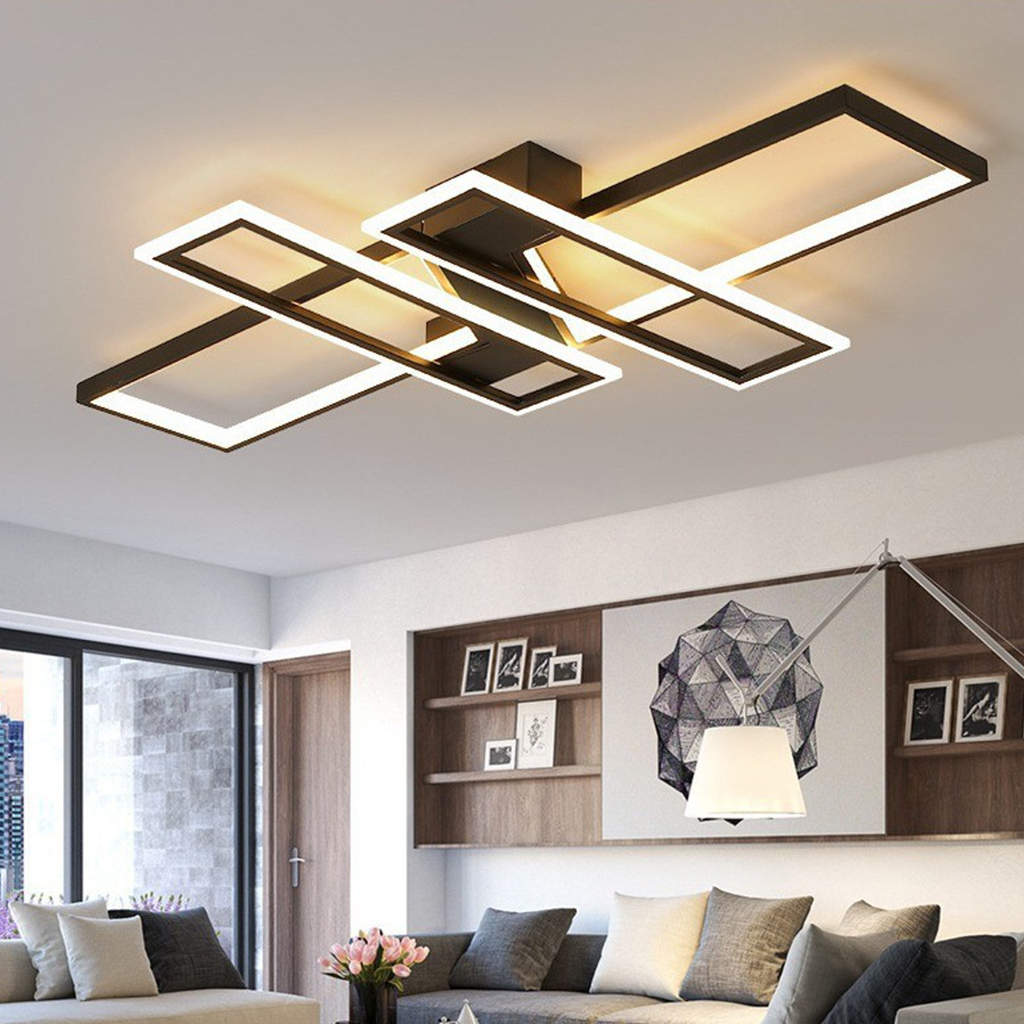 Eine moderne Deckenleuchte mit schwarzen rechteckigen Rahmen und weißen LED-Leuchten.