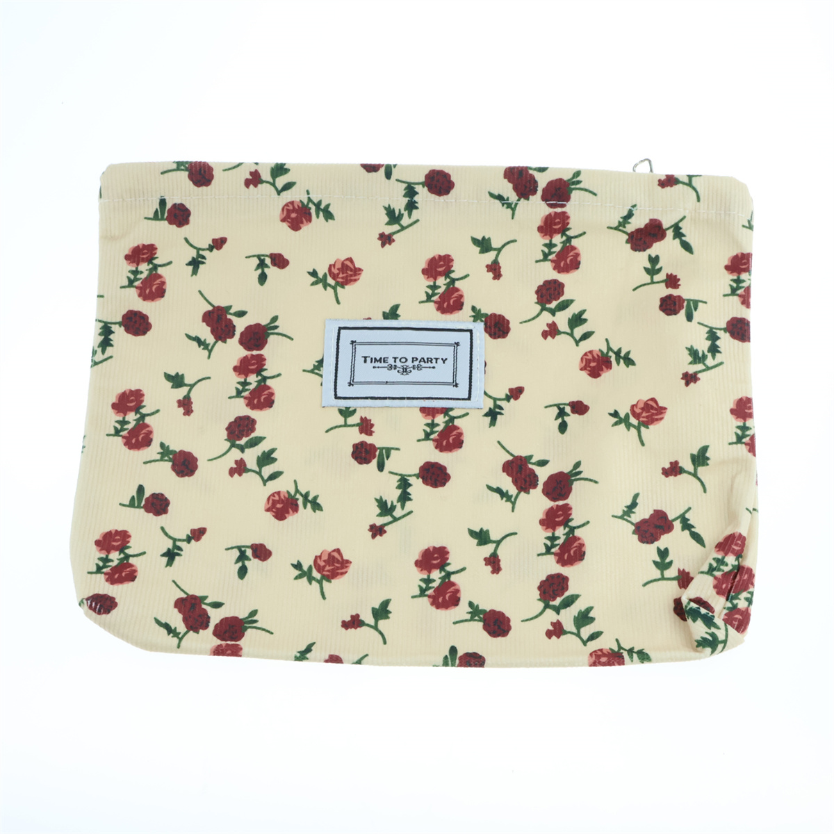 Eine cremefarbene Tasche mit Blumenmuster und einem weißen Etikett mit der Aufschrift „TIME TO PARTY“.
