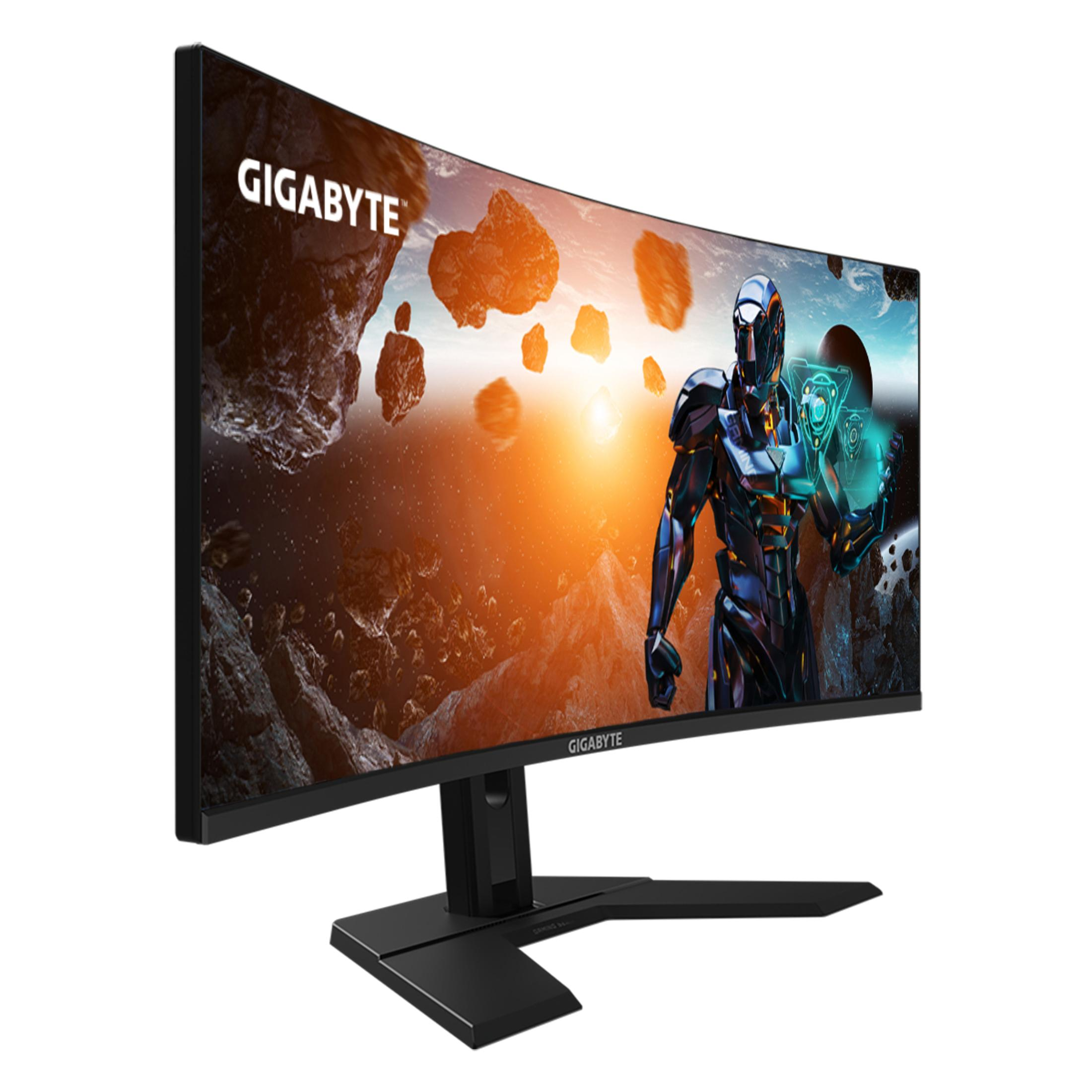 Monitor curvo da gaming con logo GIGABYTE, che mostra una scena futuristica.