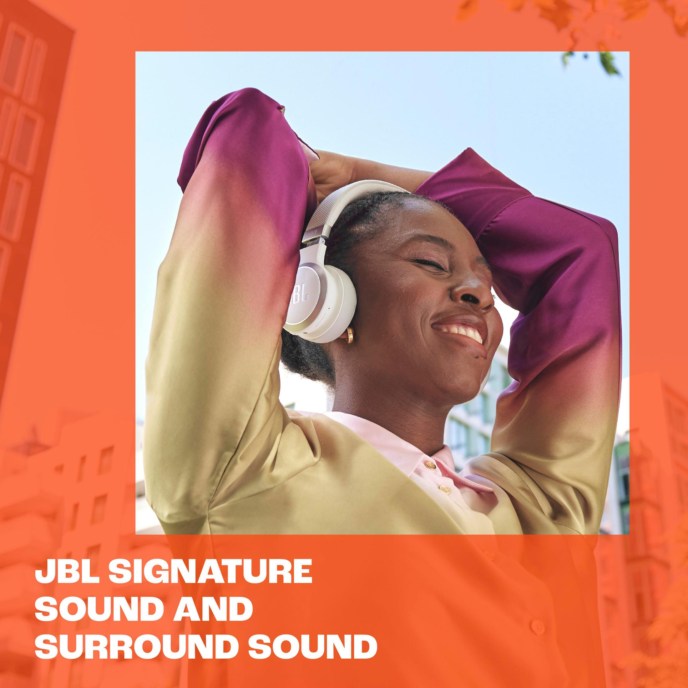 Kobieta w białych słuchawkach uśmiecha się. Pomarańczowe tło z napisem 'JBL Signature Sound'.
