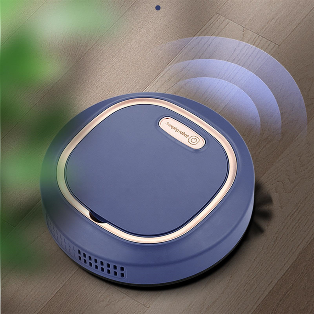 Ein blauer Roboter-Staubsauger auf einem Holzboden. Es hat einen Goldring.