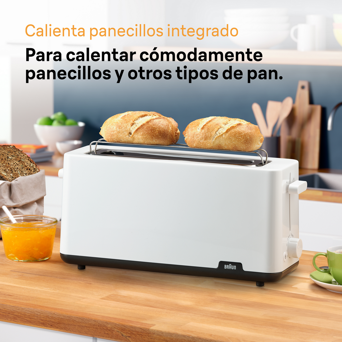 Biały toster z dwoma tostami na górze i słoikiem dżemu obok.