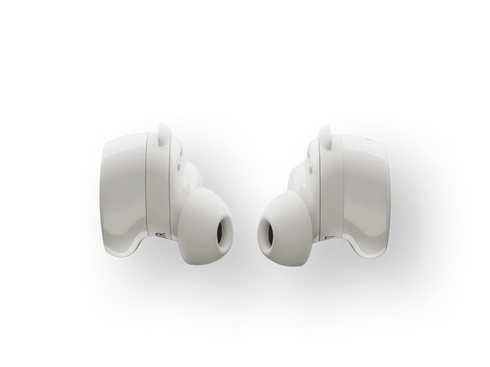Dos auriculares blancos. Los auriculares tienen forma redondeada y están sobre fondo negro.