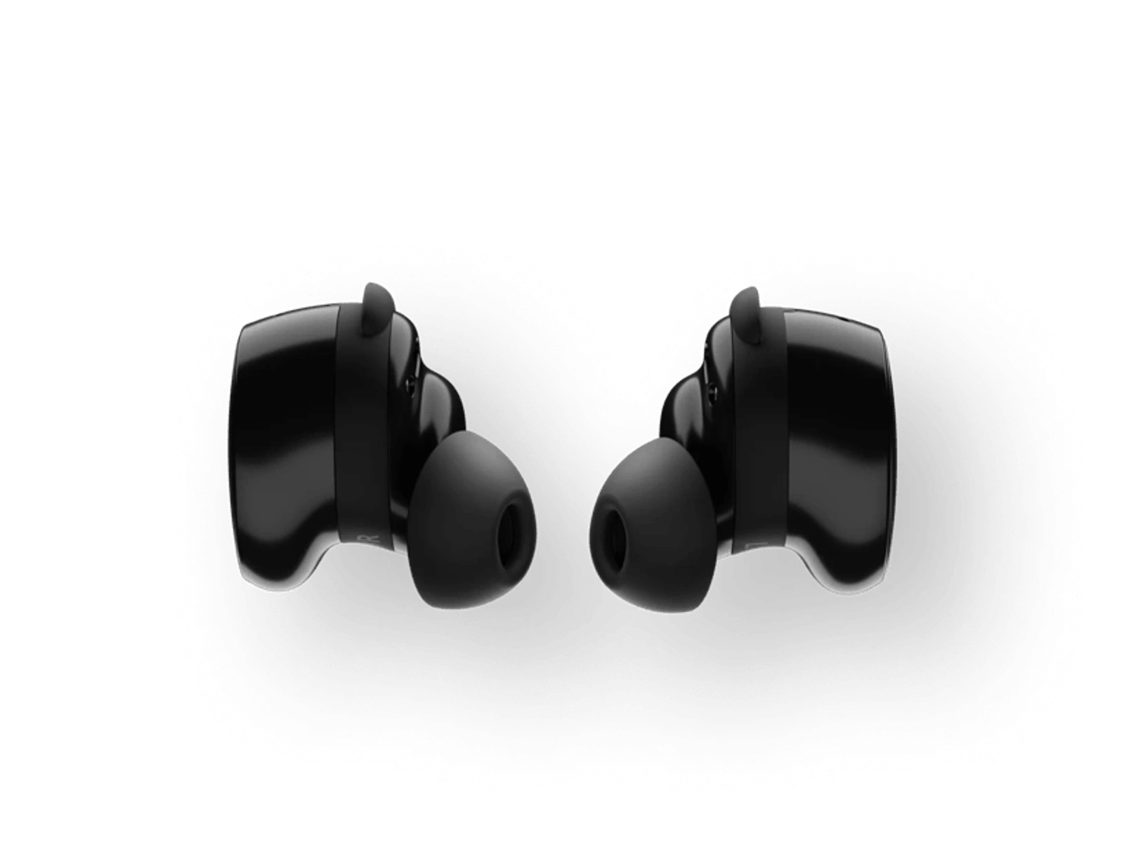Auriculares inalámbricos negros. Cada uno tiene una punta de goma y un diseño elegante.