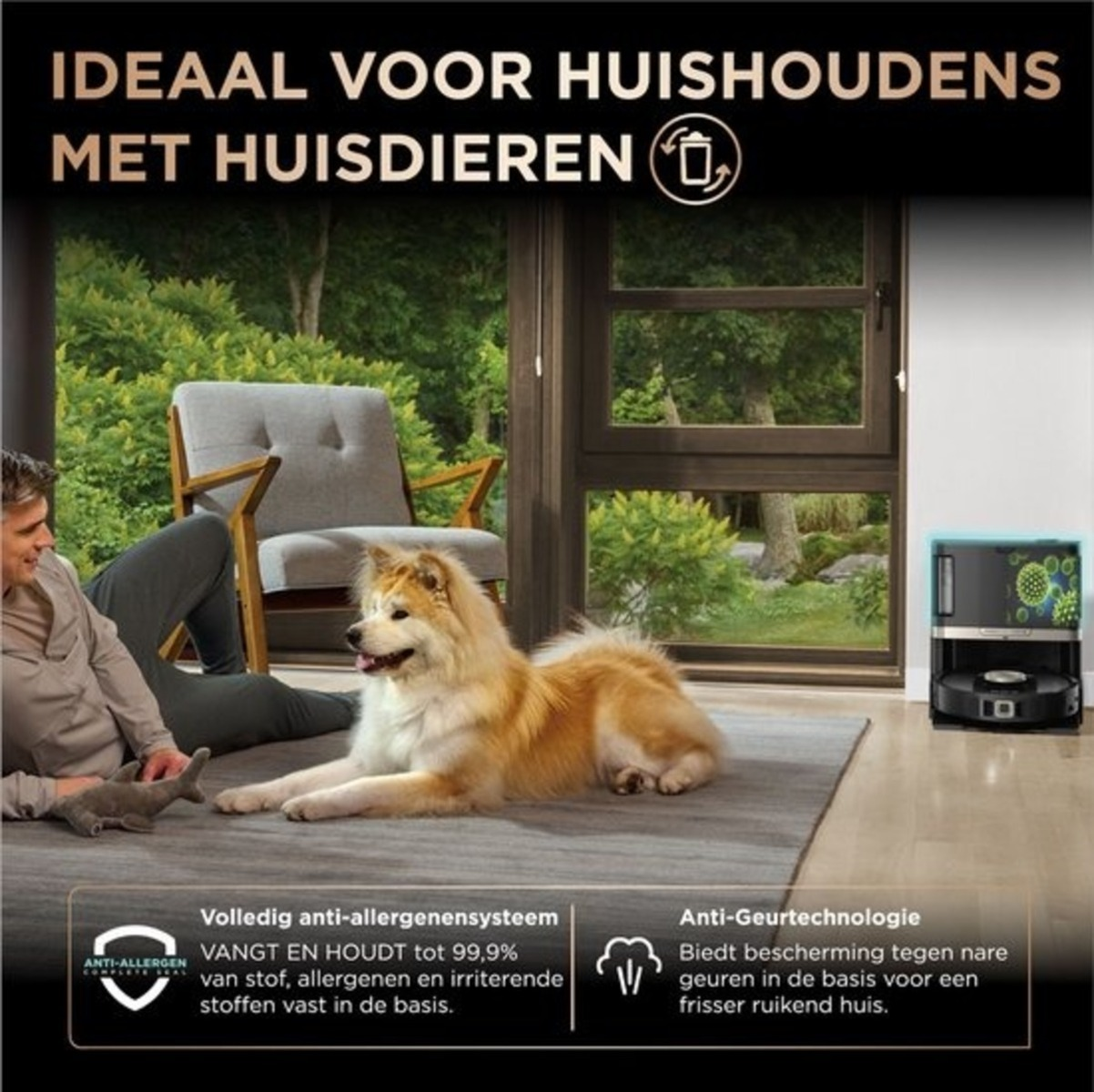 Osoba siedząca obok psa, w tle robot odkurzający.