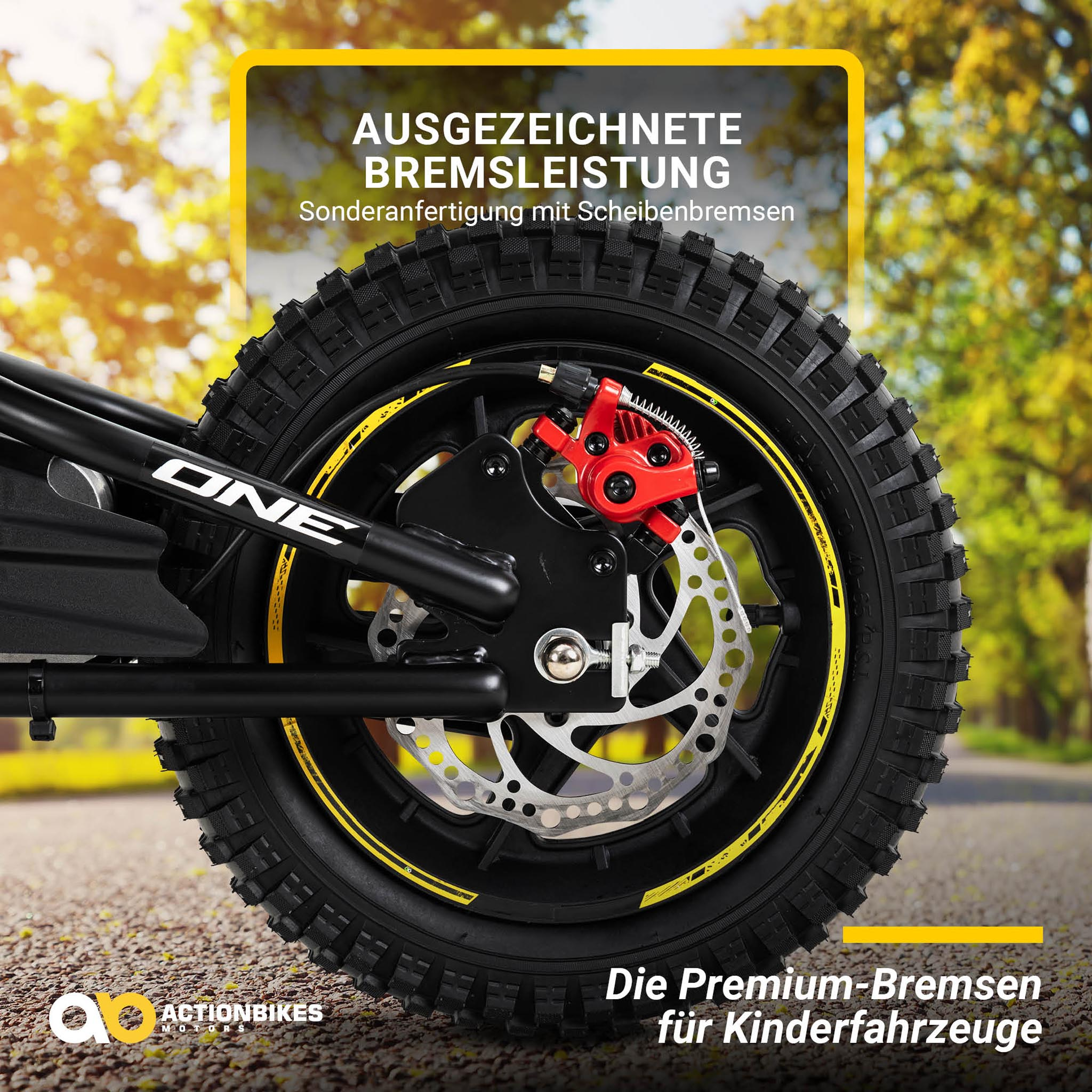 Nahaufnahme eines Fahrradrads mit gelben Akzenten. Rote Bremssättel und eine Scheibenbremse sind sichtbar.