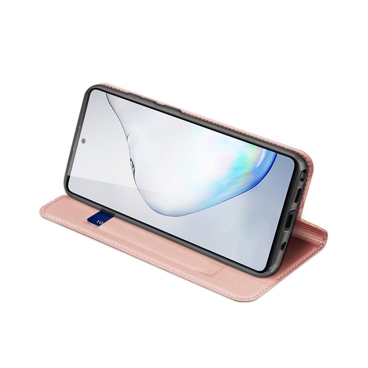 Una custodia per telefono rosa con un telefono all'interno è esposta su una superficie bianca.