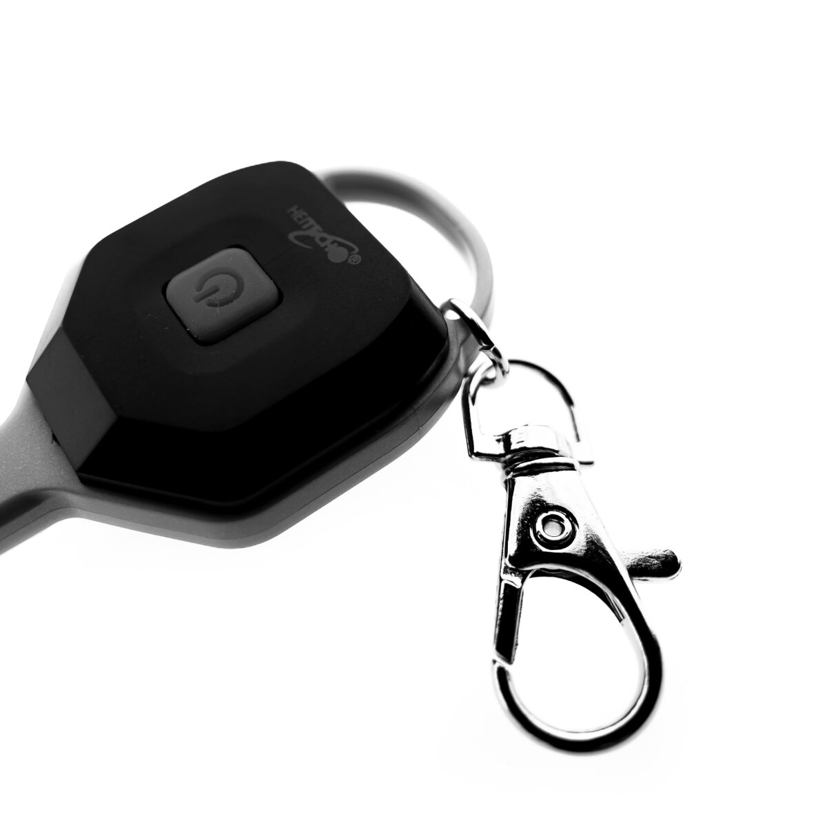 Eine schwarze Autoschlüsselfernbedienung mit silbernem Clip wird auf weißem Hintergrund gezeigt.
