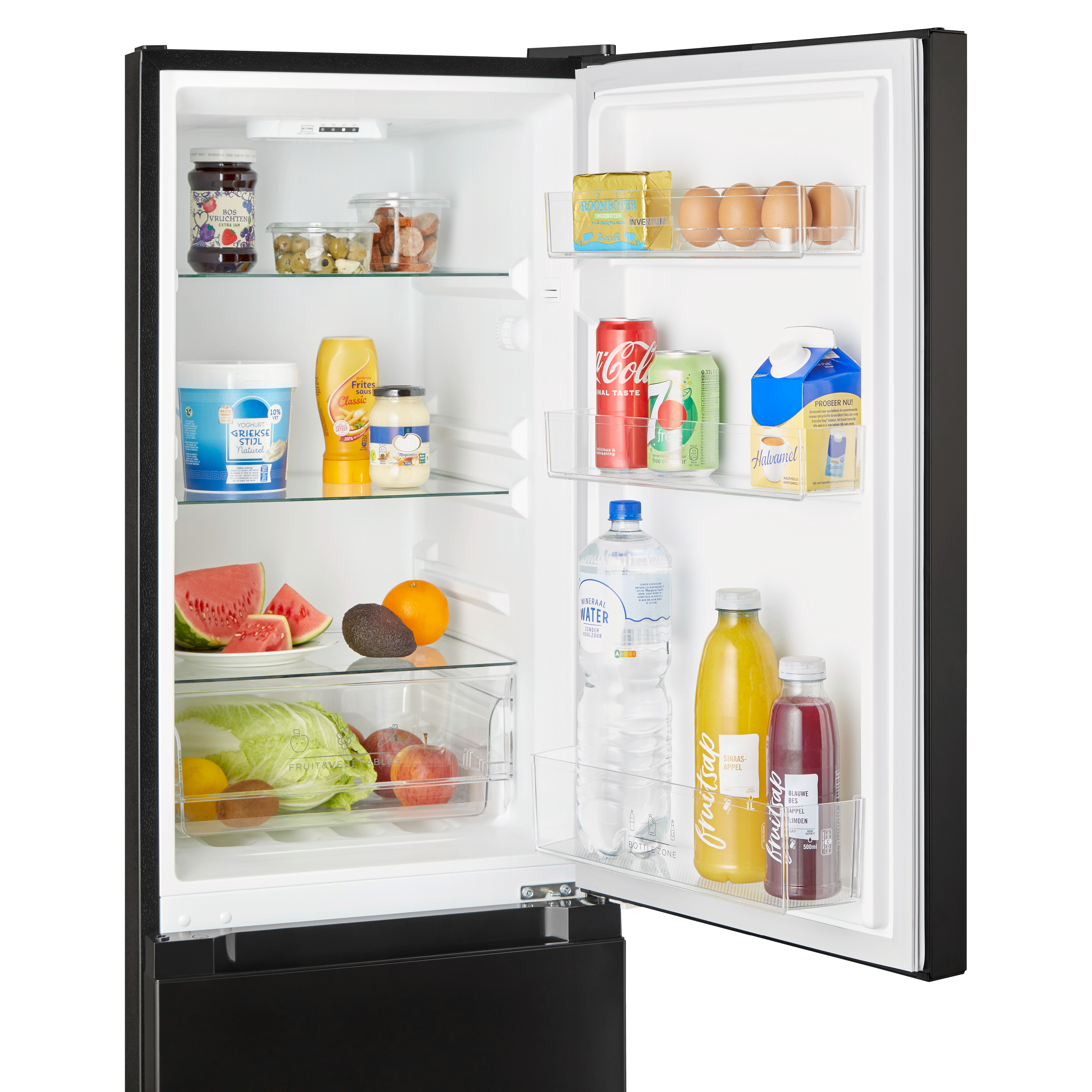 Open refrigerator door with contents. Includes produce, drinks, condiments, and dairy products.