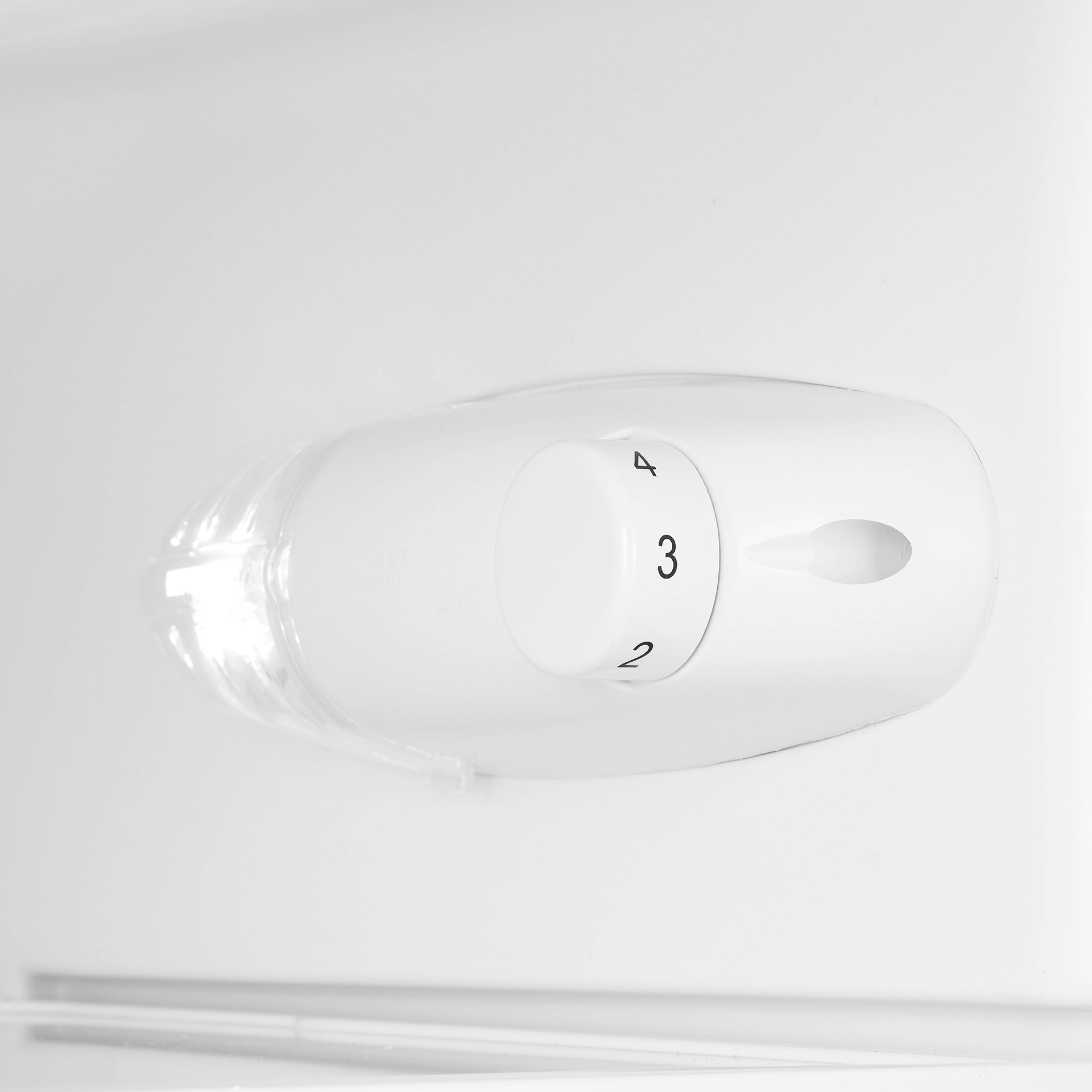 Close-up of a white refrigerator temperature control dial with numbers 2, 3, and 4.