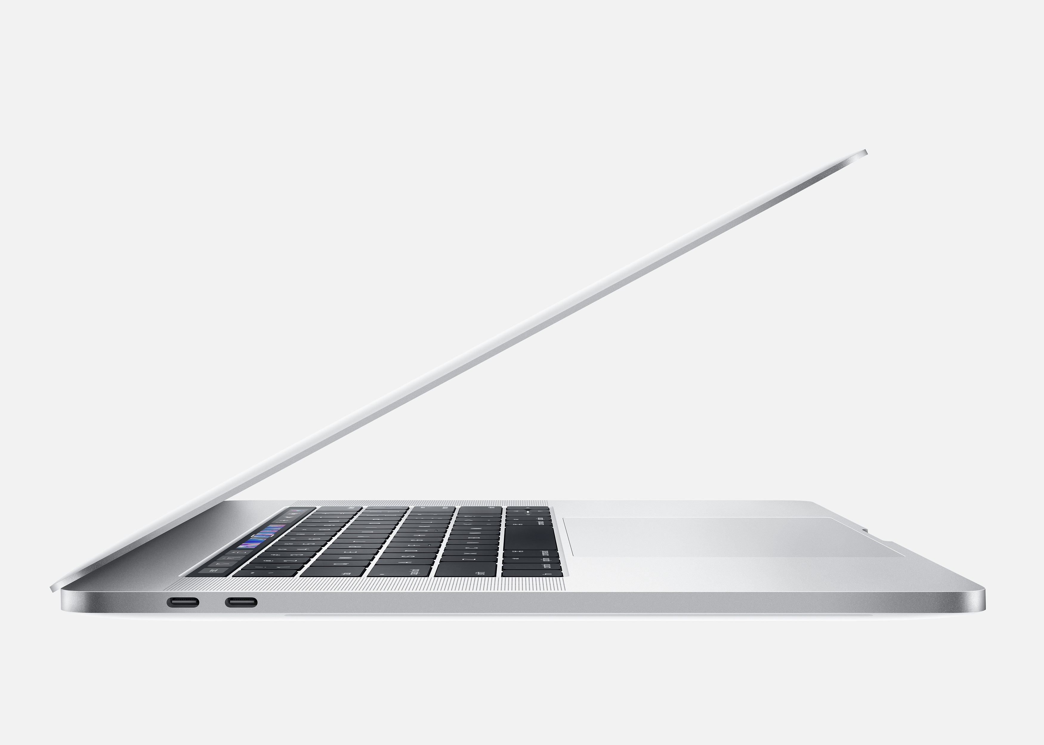 Laptop argentato, vista laterale, aperto su una superficie bianca.