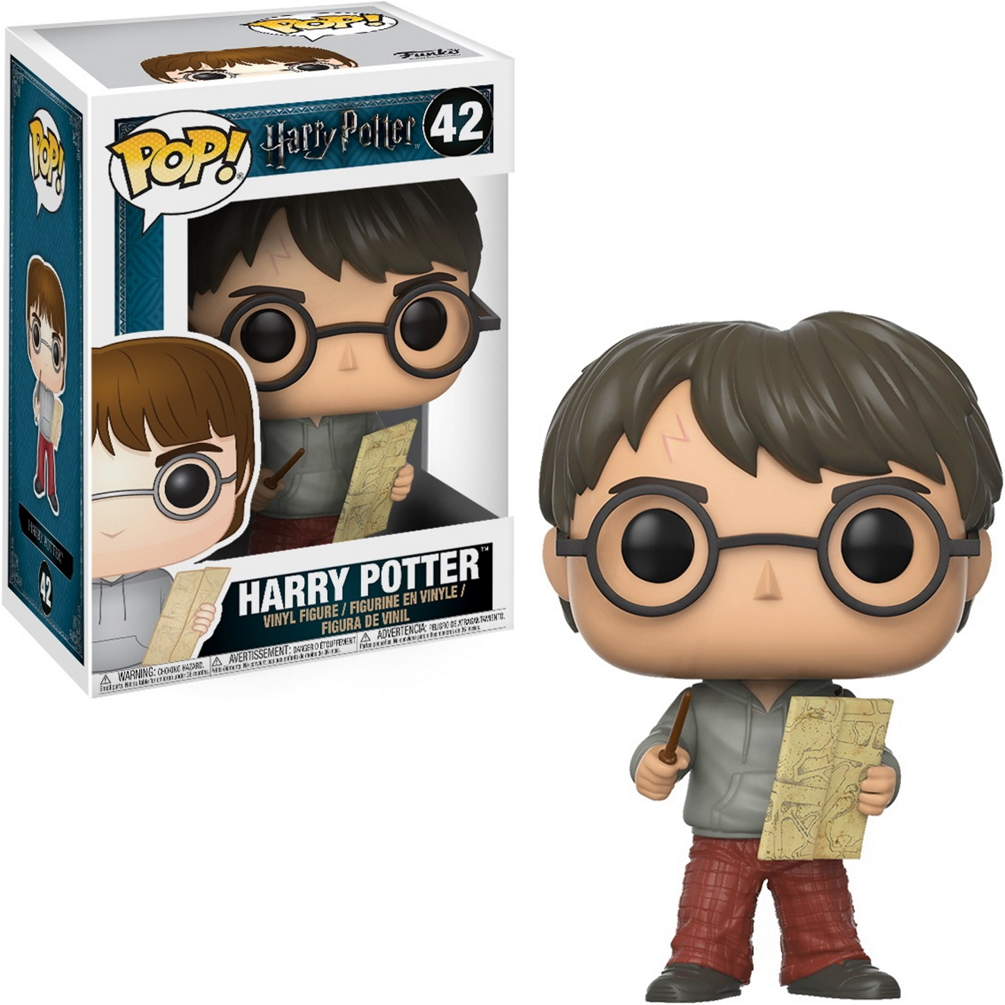 Statuetta di Harry Potter. Tiene in mano una bacchetta e una mappa, con una scatola sullo sfondo.