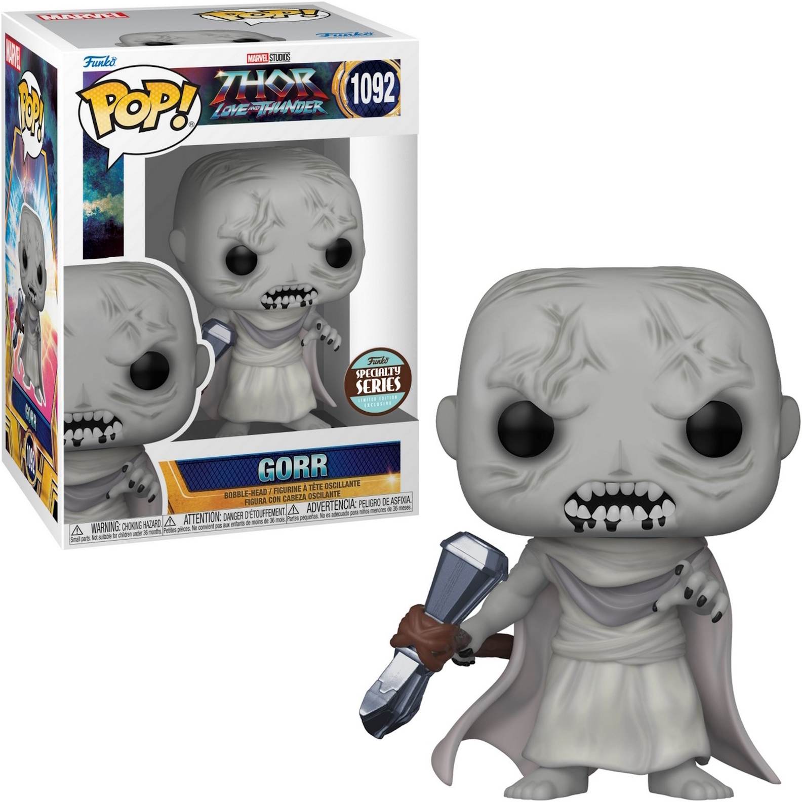 Figura di Gorr dal film Thor, pelle grigia, che tiene un'arma, con una scatola a sinistra.