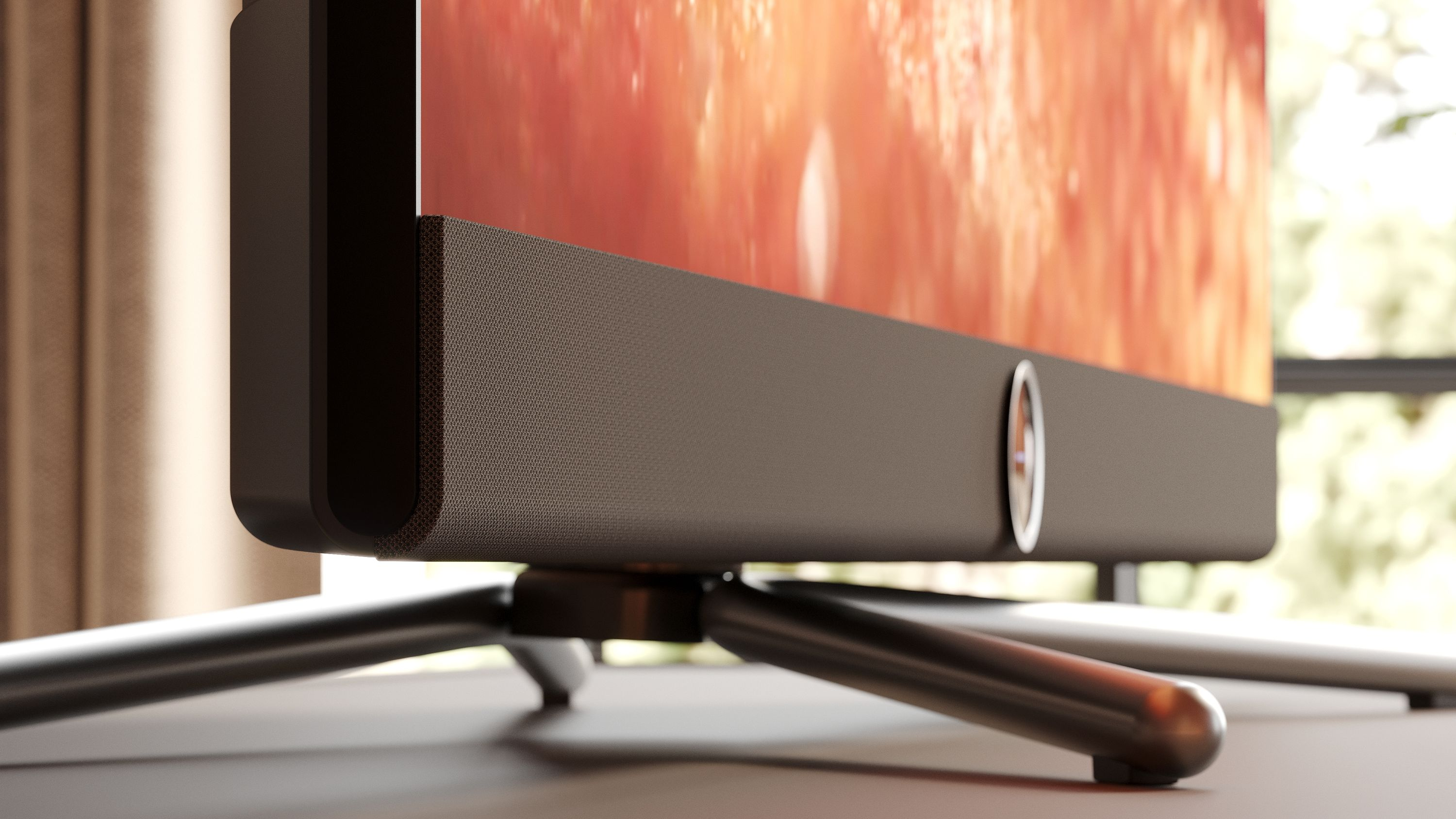 Nahaufnahme eines Fernsehers mit Soundbar. Der Fernseher steht auf einem Stativ mit unscharfem Hintergrund.
