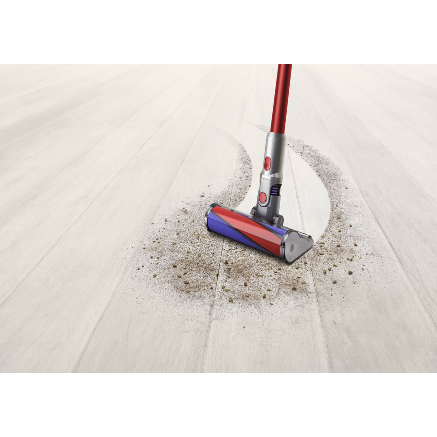 Głowica odkurzacza na drewnianej podłodze, czyszcząca ścieżkę brudu, biała, czerwona i niebieska.