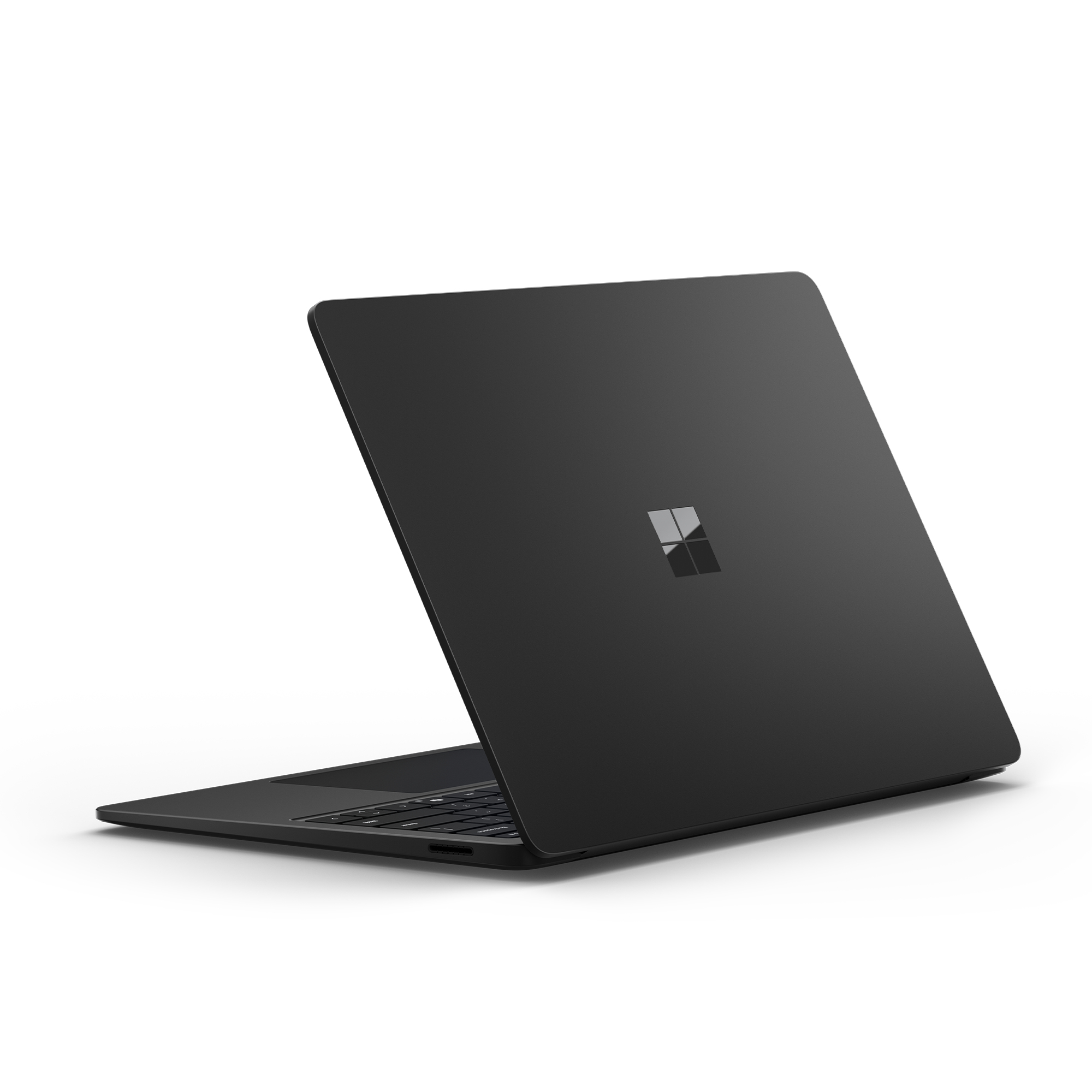 Czarny laptop Microsoft, pod kątem, otwarty. Pokazuje logo Microsoft. Białe tło.