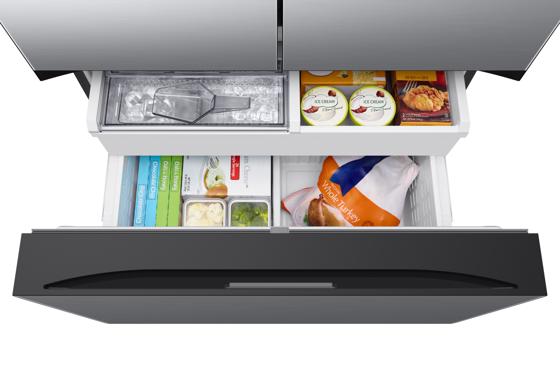 Refrigerator drawers open, showing frozen foods and ice. Top down view.