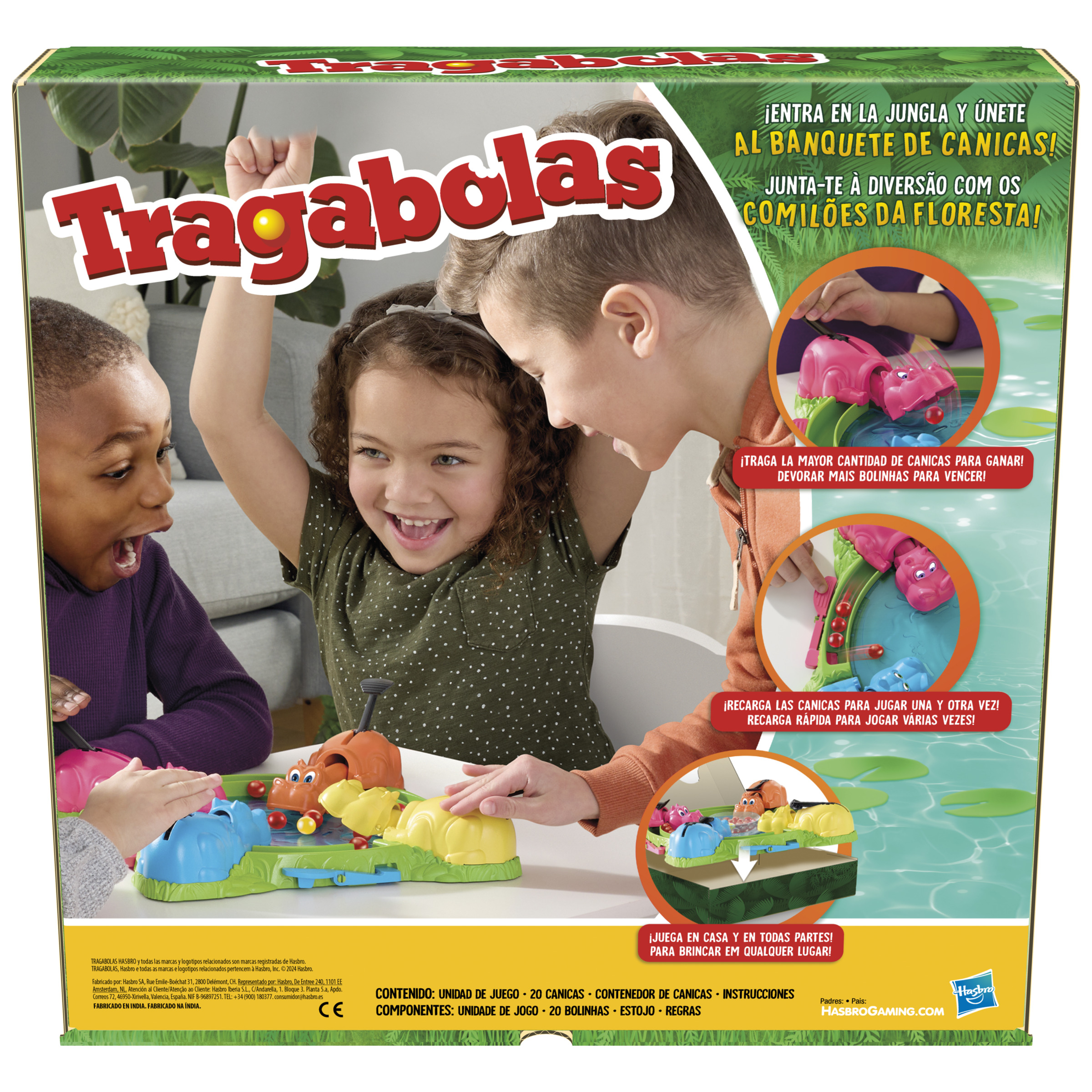 Niños jugando al juego Tragabolas. La caja y el juego son visibles, con componentes coloridos.