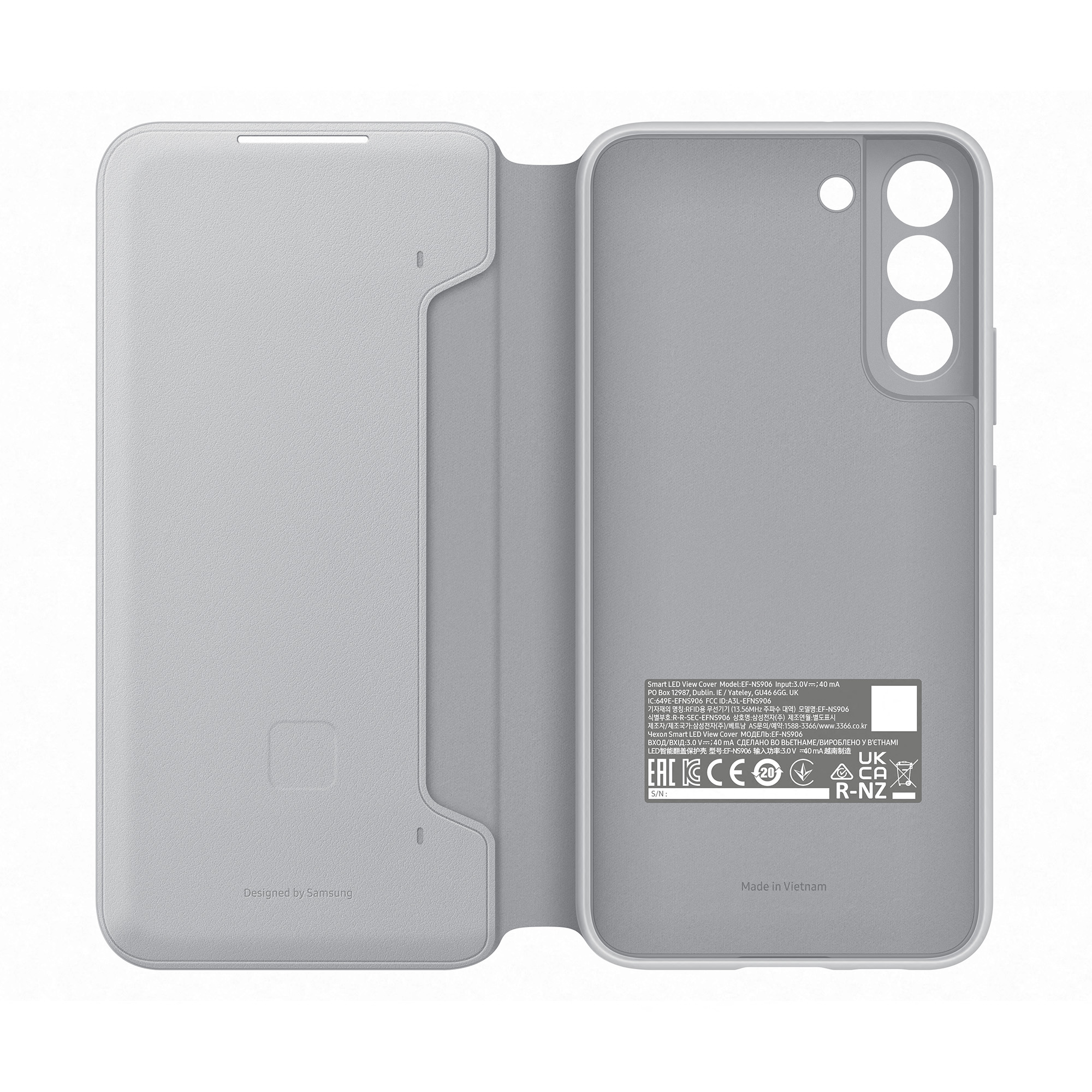 Funda de teléfono gris abierta. En el interior hay etiquetas y símbolos: garantía, reciclaje y detalles de fabricación.