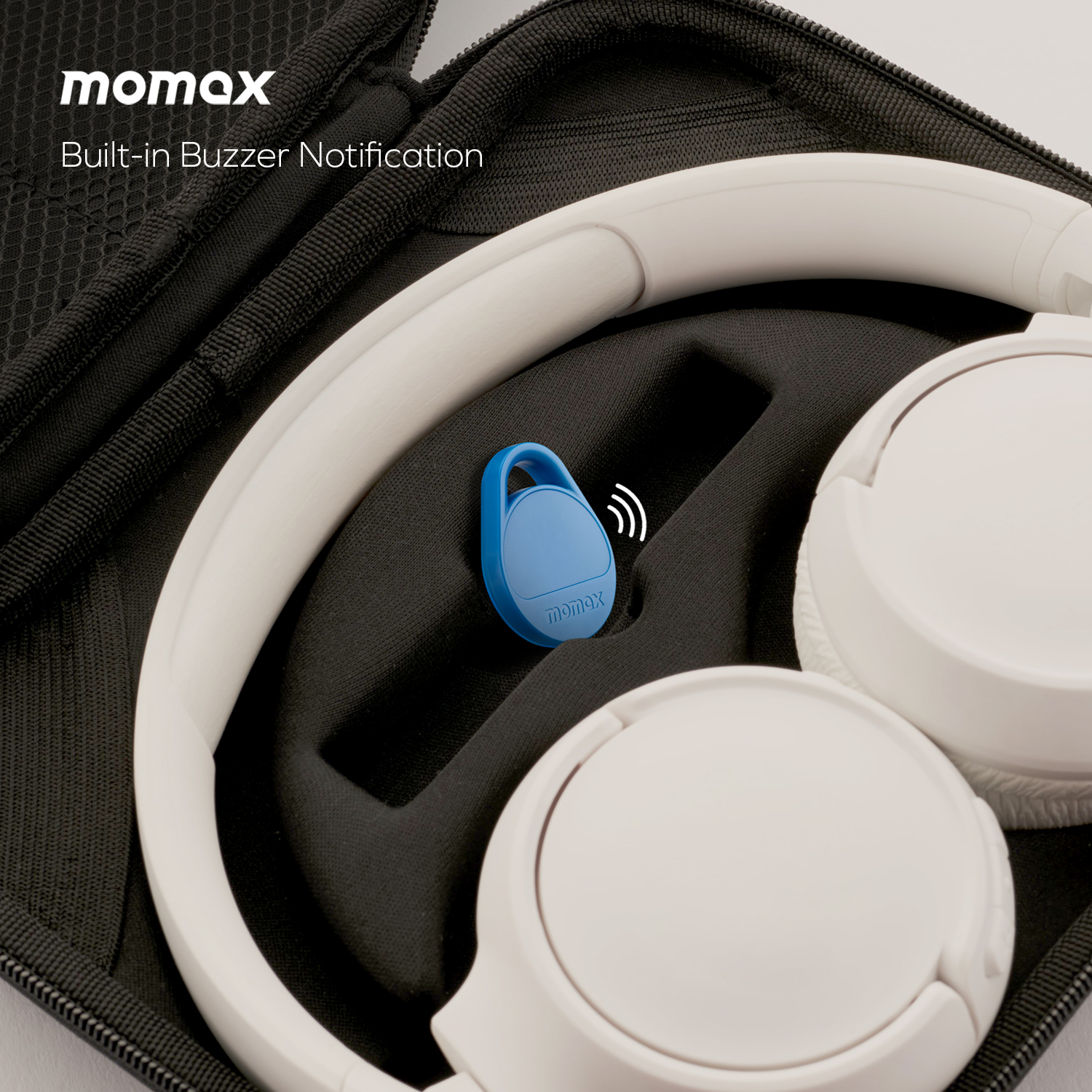 White headphones in a black case, with a blue tag.