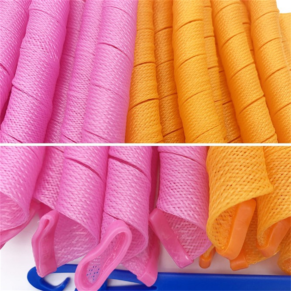 Nahaufnahme von rosa und orangefarbenen Spiral-Haarwicklern mit blauem Griff.