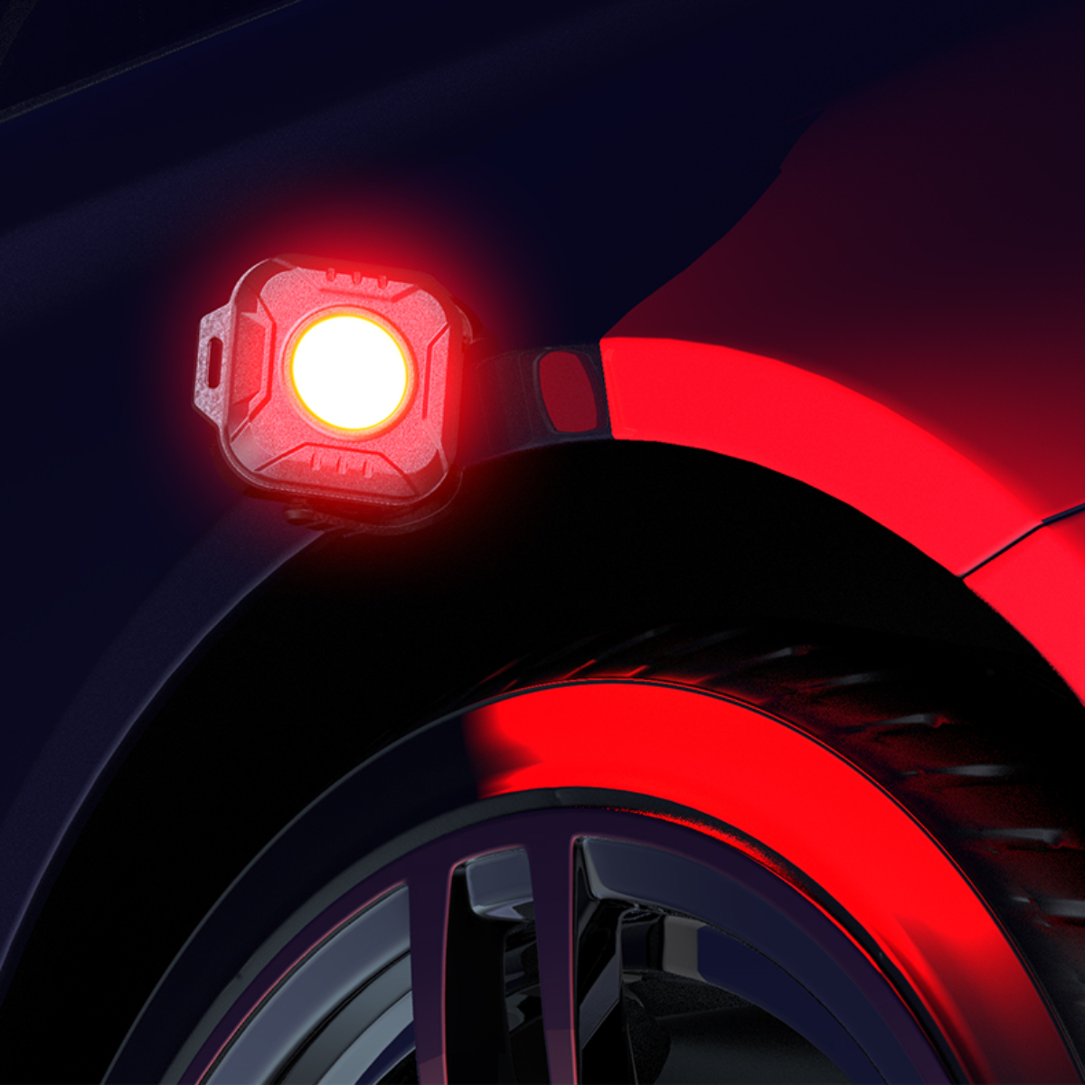 Rotes Autolicht an der Seite eines Autos. Das Auto ist dunkelblau.