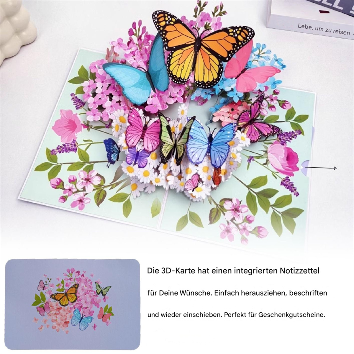 Eine 3D-Pop-up-Karte mit bunten Schmetterlingen und Blumen. Ein Notizblock ist ebenfalls enthalten.