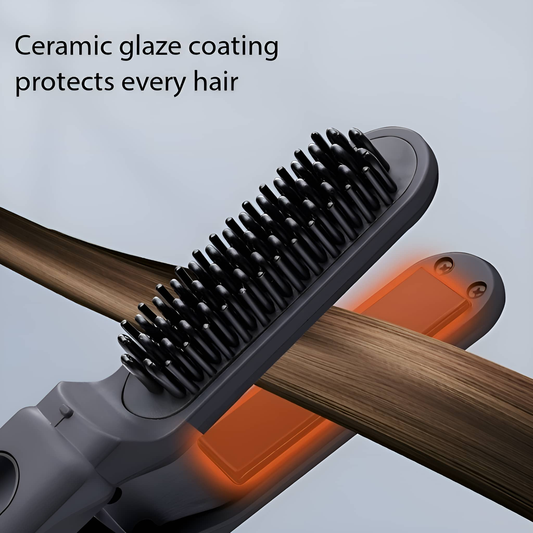 Eine Haarglättbürste mit schwarzen Borsten und einer orangefarbenen Heizplatte.