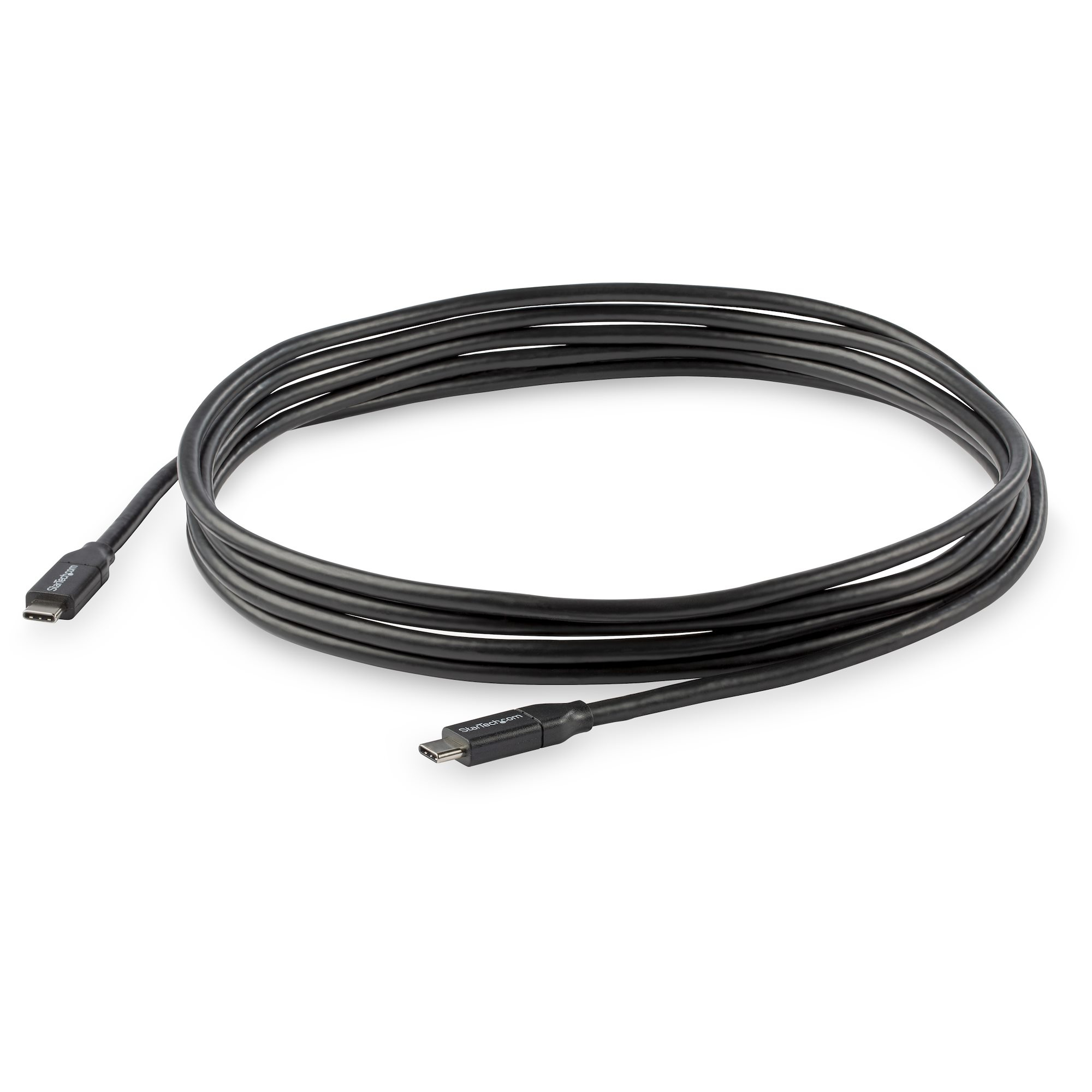 Un cable USB-C negro enrollado sobre una superficie blanca.