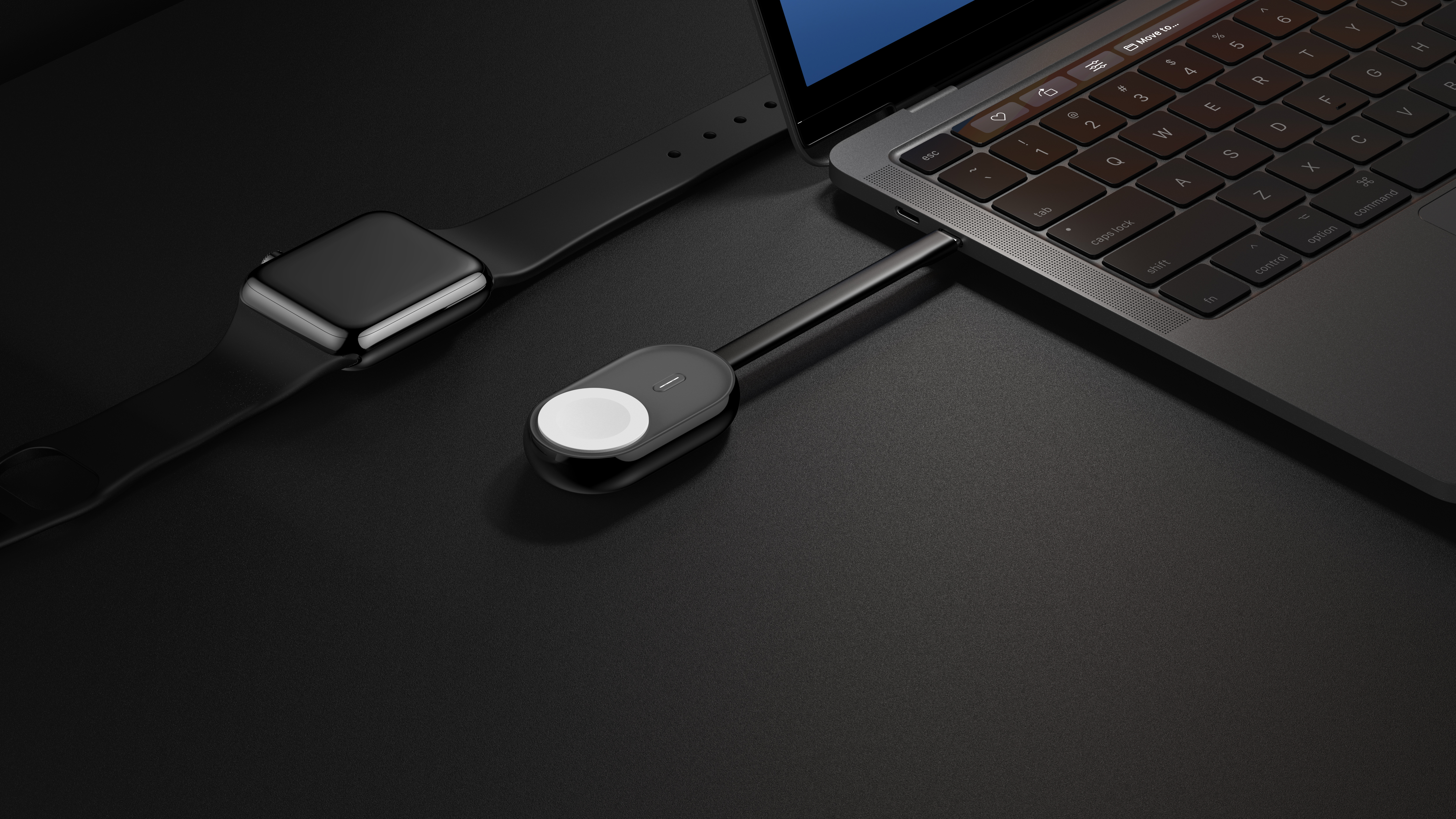 Schwarzer Laptop mit Ladekabel und eine schwarze Smartwatch auf der linken Seite.
