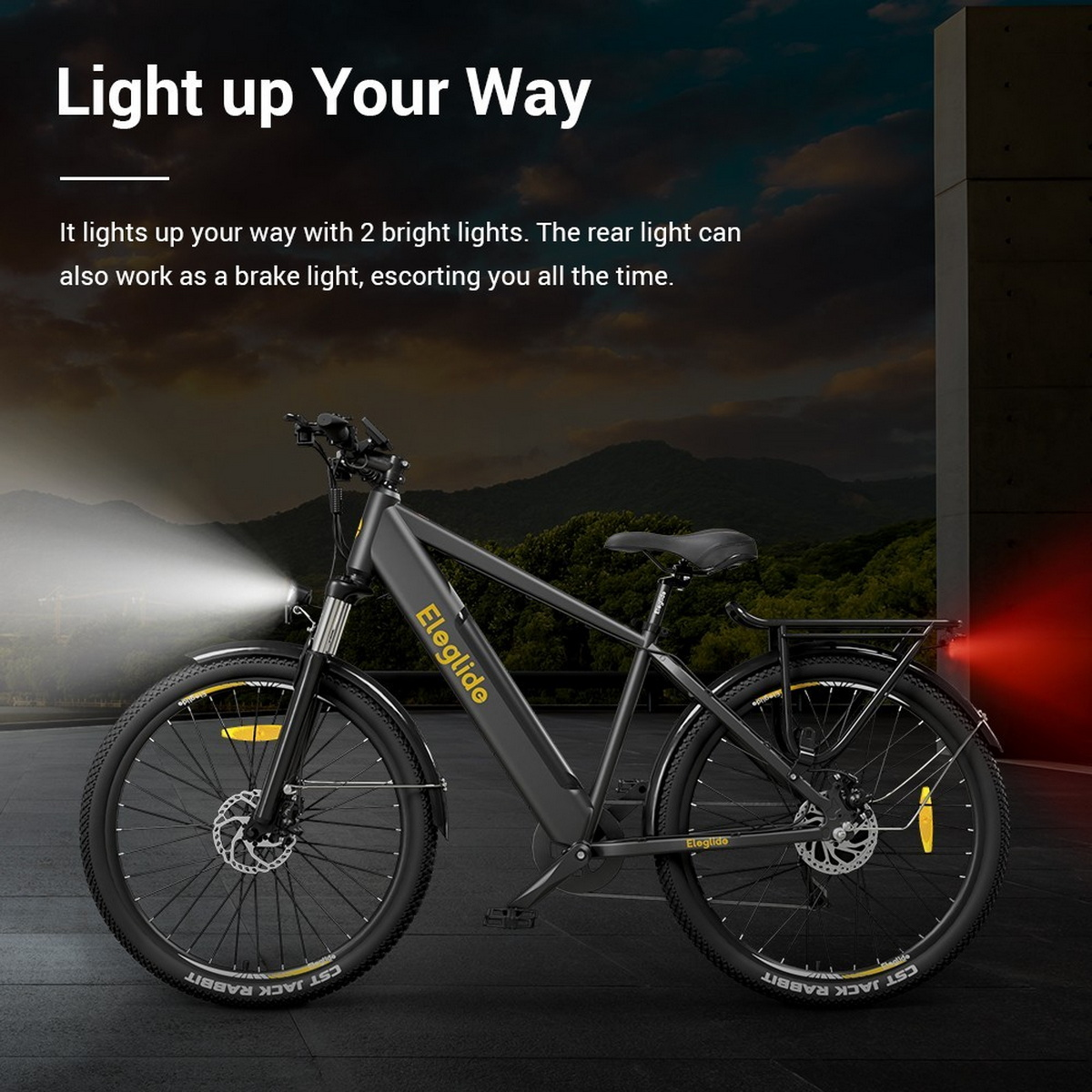 Ein schwarz-graues Elektrofahrrad auf der Straße, mit Text: Light up Your Way. Rücklicht ist rot.