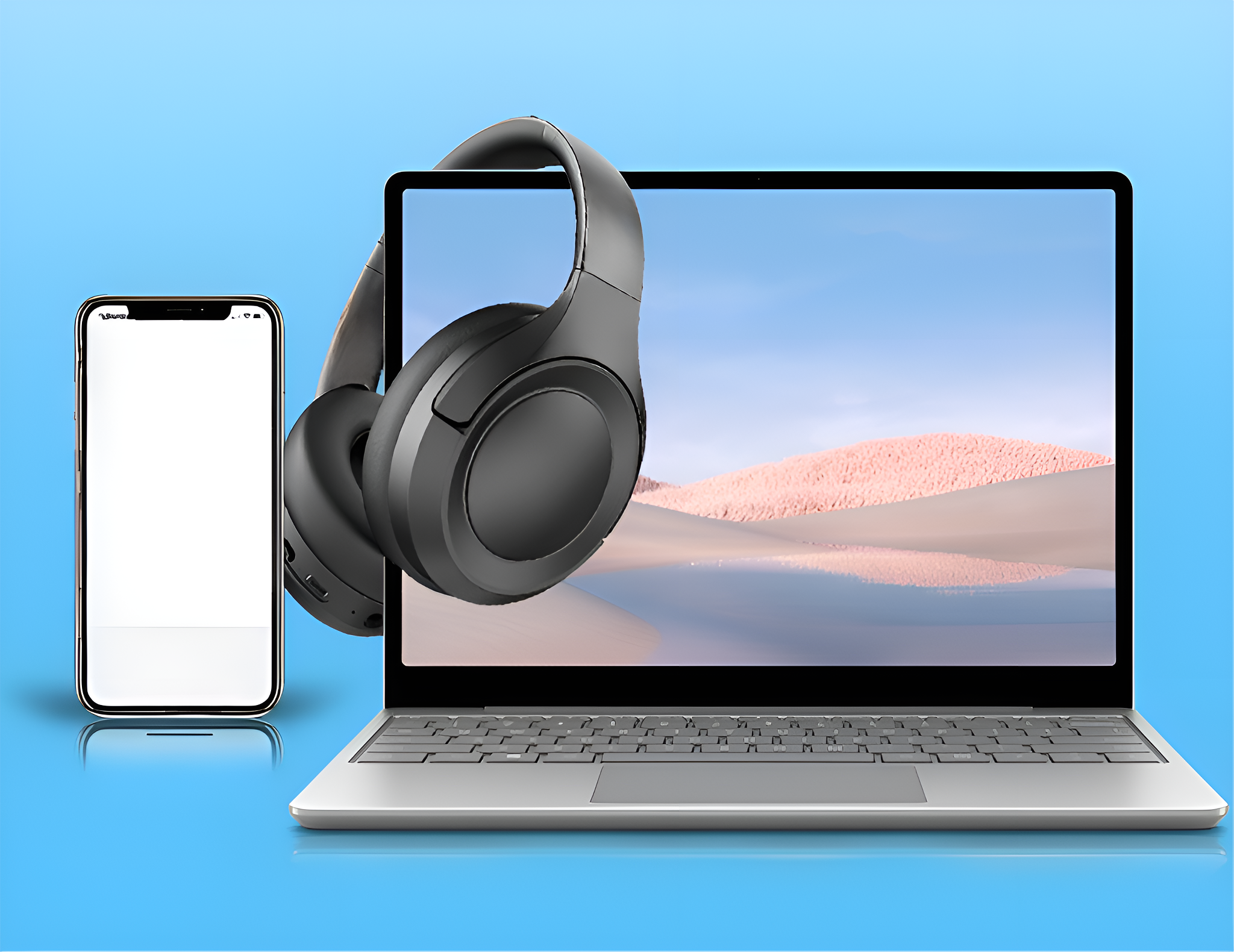 Smartphone und Kopfhörer neben einem Laptop. Der Laptop-Bildschirm zeigt eine Landschaft.